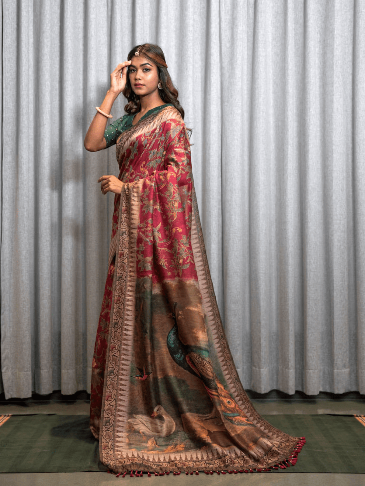 Aromie Saree in rich red and gold with intricate peacock design, perfect for special occasions and available for Saree online Canada.