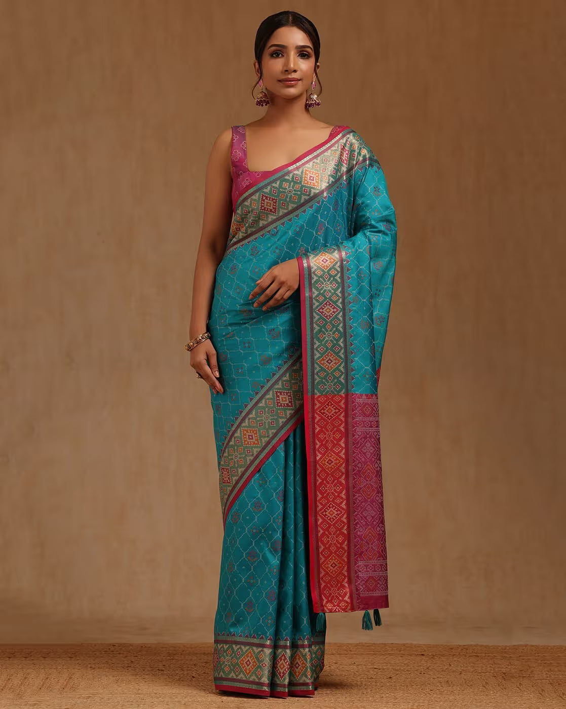 Beautiful turquoise saree with intricate patterns in silk, perfect for weddings and special occasions. Saree online Canada.