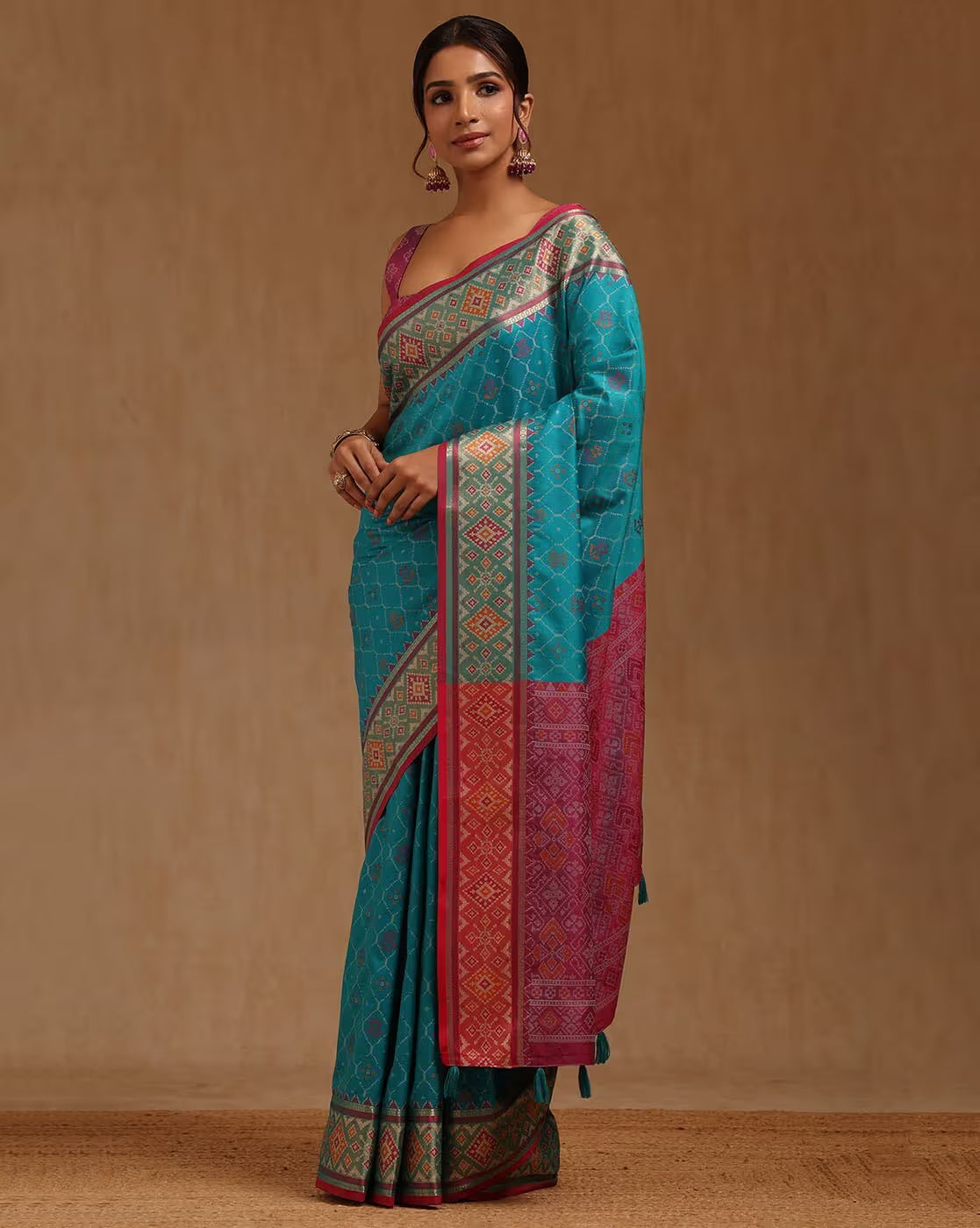 Turquoise and pink saree with intricate patterns, perfect for weddings, available saree online Canada