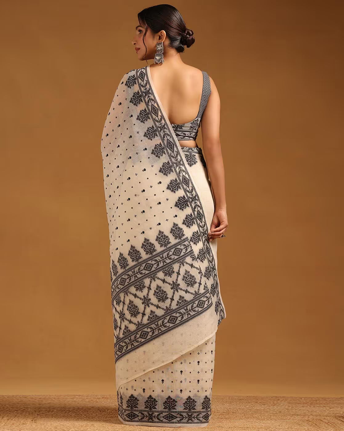 Elegant cream satin saree with intricate black embroidery, ideal for formal events in Canada