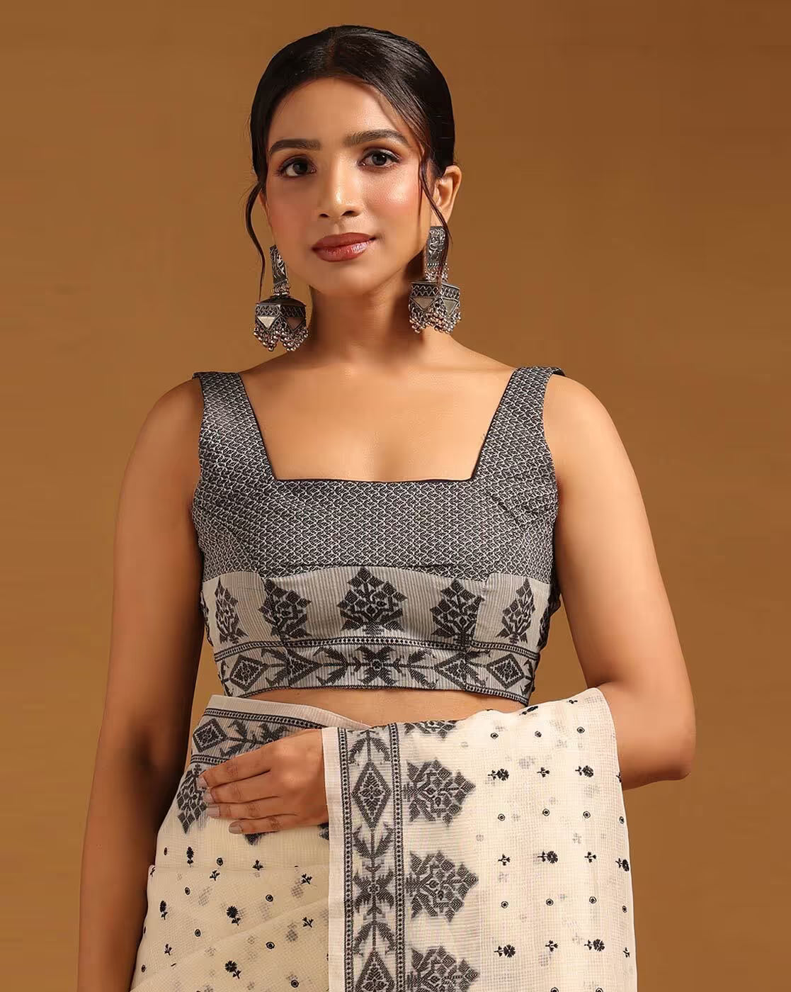Elegant black and ivory satin saree Canada for festive occasions featuring intricate patterns and a stylish blouse