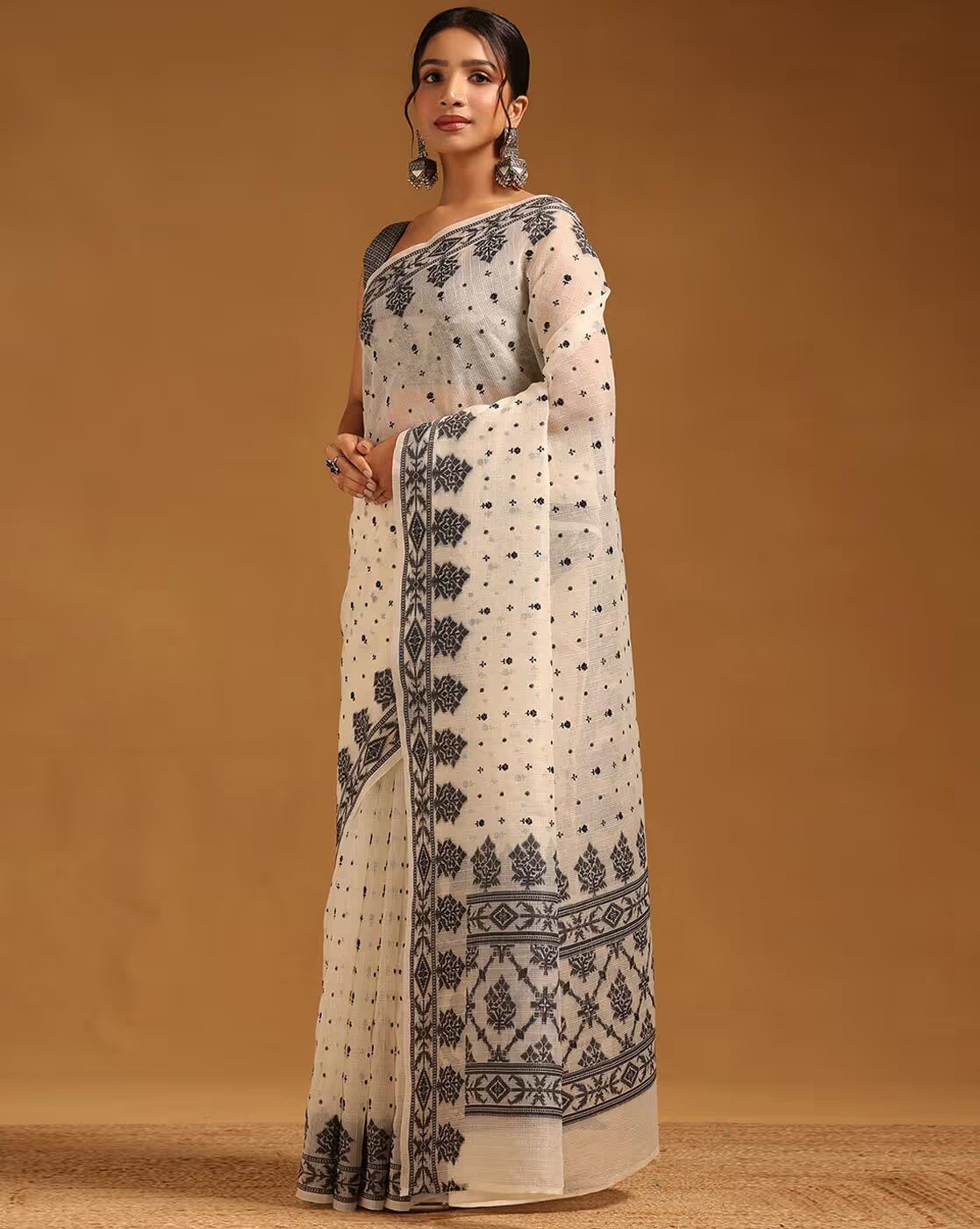 Elegant cream satin saree with black embroidery, perfect for formal events in Canada.