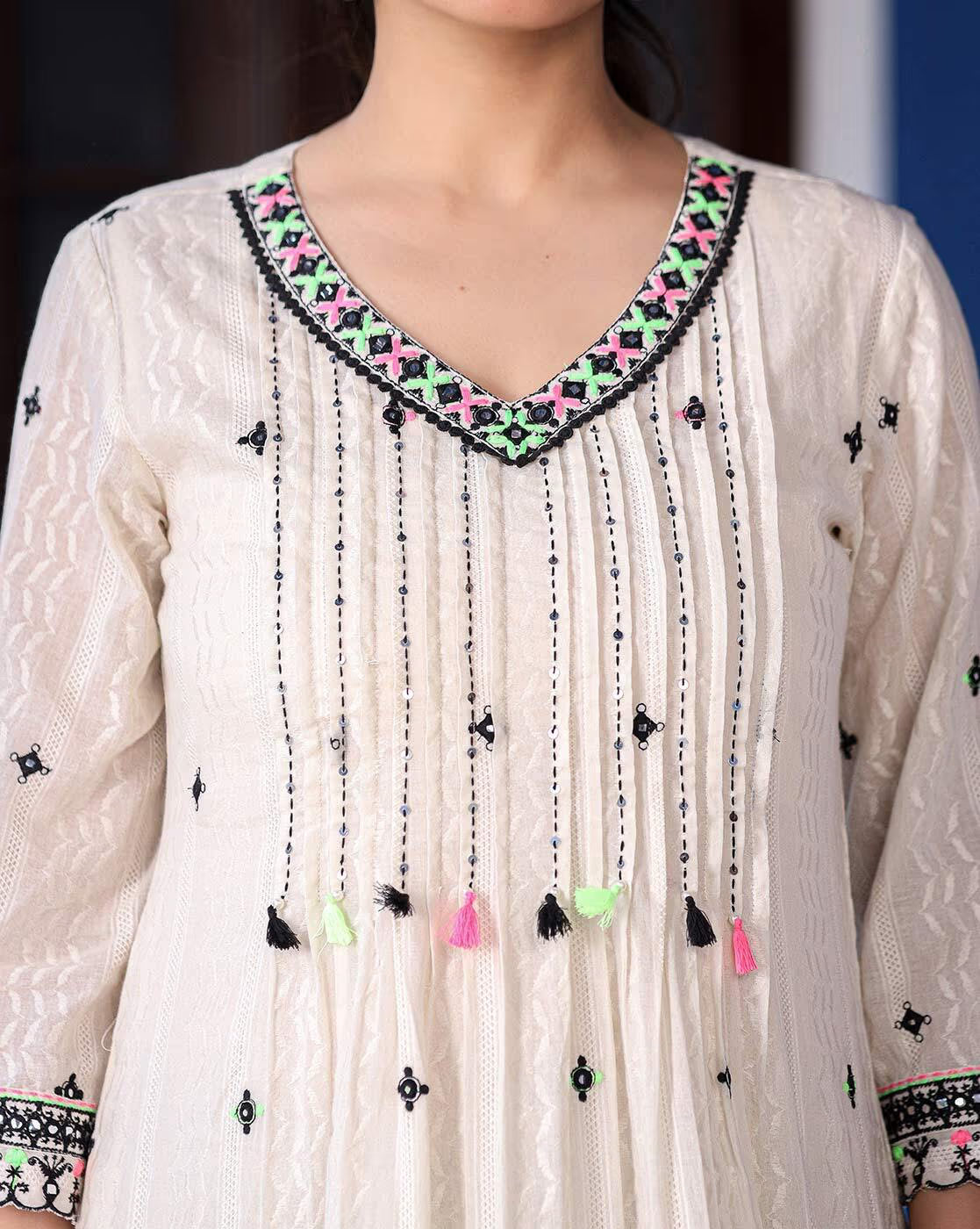 Elegant sea green ethnic kurta set featuring intricate embroidery and tassel details