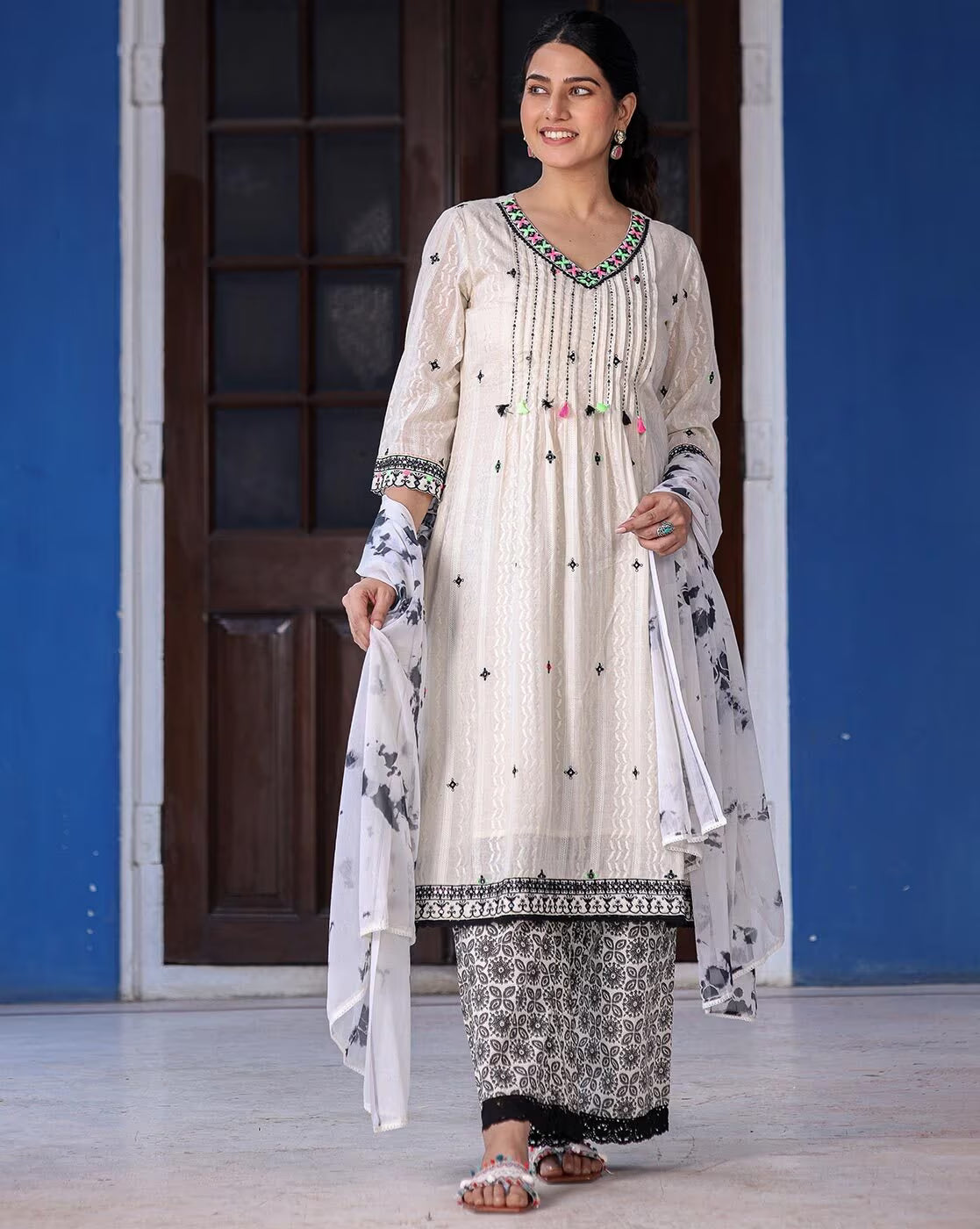 Elegant sea green ethnic kurta set featuring intricate embroidery and matching bottoms with a stylish dupatta