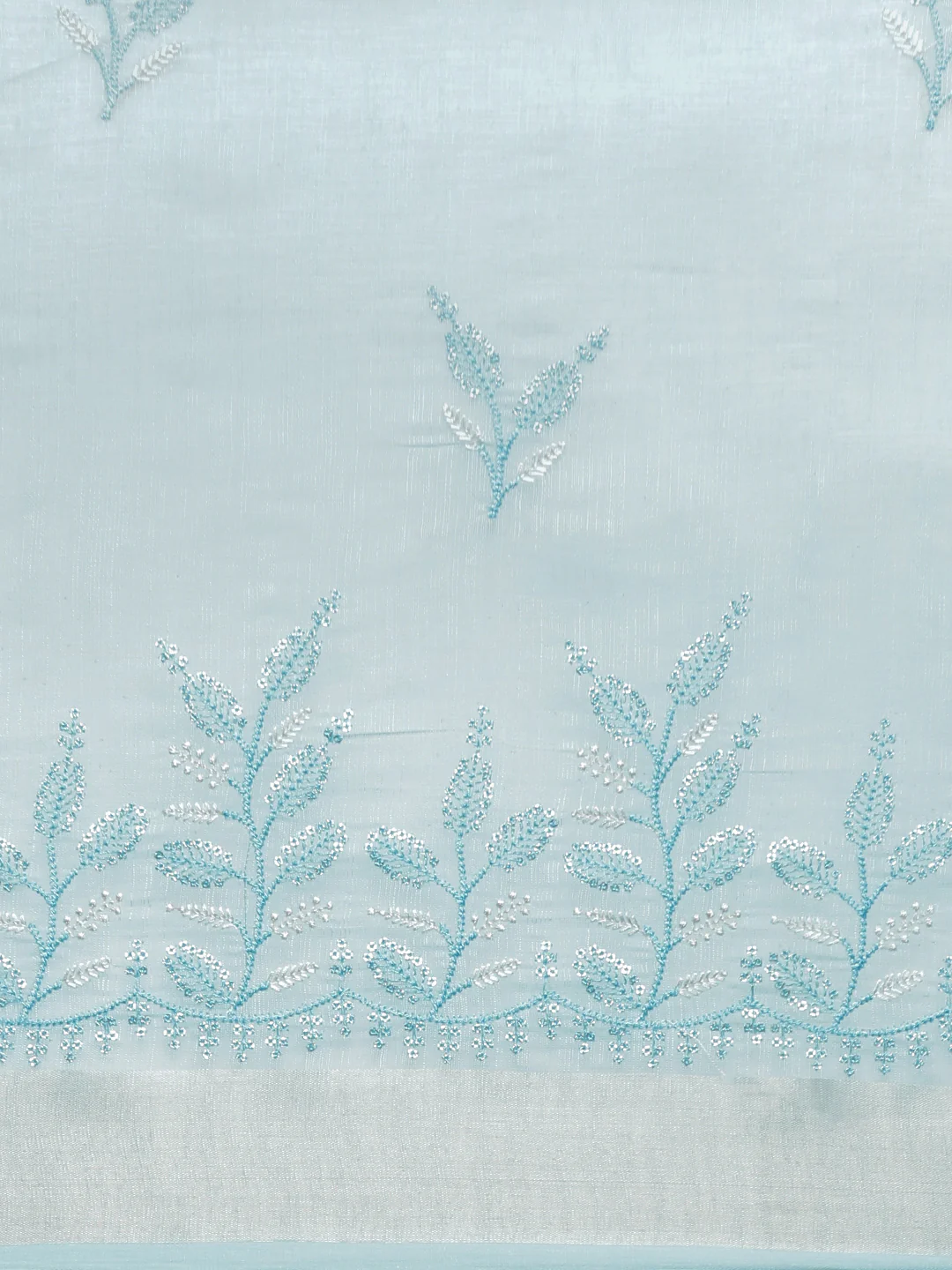 Light blue semi linen embroidered saree with intricate floral designs, ideal for festive occasions in Canada.