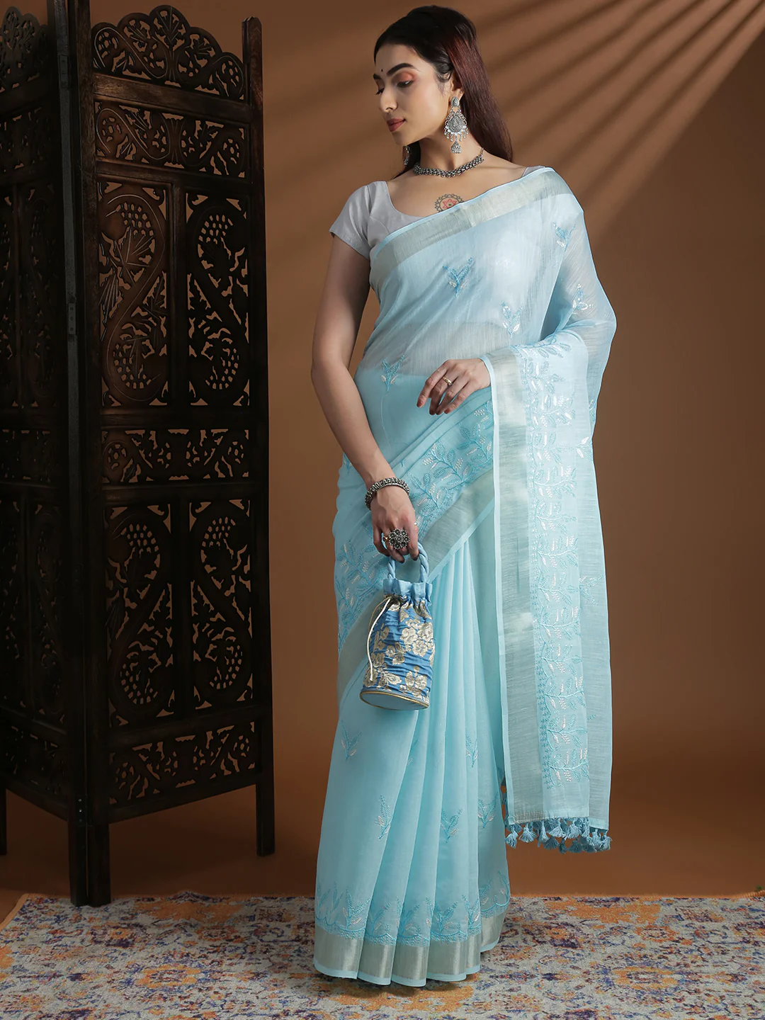 Front view of a light blue semi linen embroidered saree Canada perfect for weddings and festive occasions