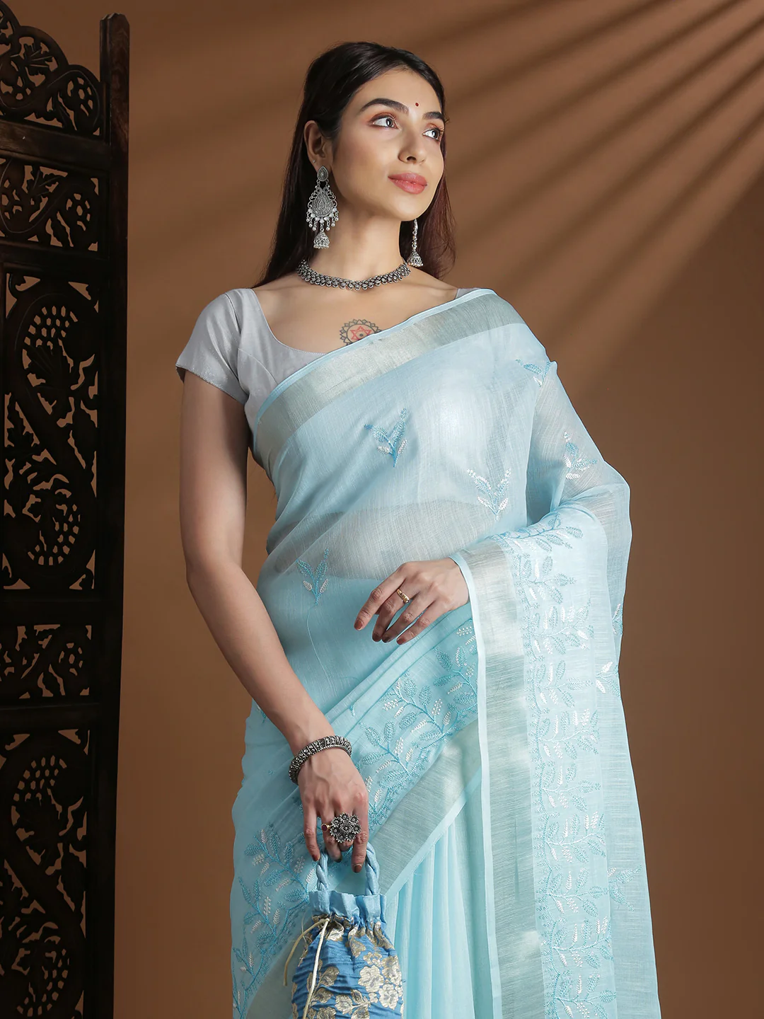 Semi linen embroidered saree in light blue from Aromie, ideal for weddings and formal events