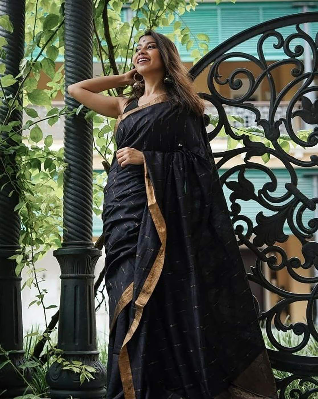 Aromie sequin embellished saree online in elegant black with gold accents and luxurious draping