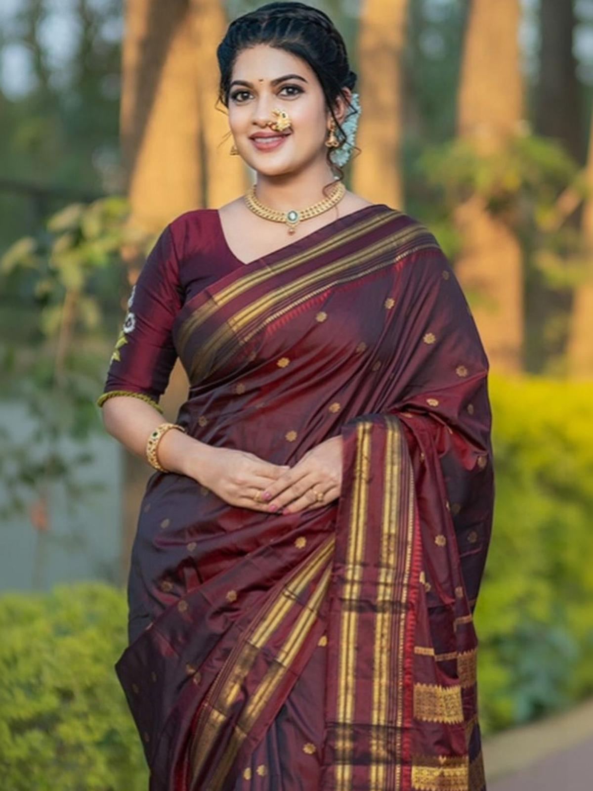 Maroon sequin embellished saree online with gold zari borders, perfect for festive occasions and celebrations.