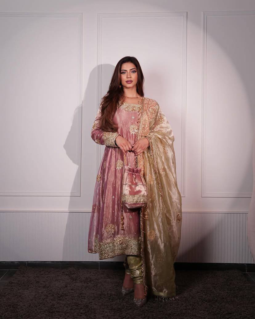 Elegant three piece sequin embroidered kurta pant set in pastel pink and gold, perfect for weddings or festive occasions