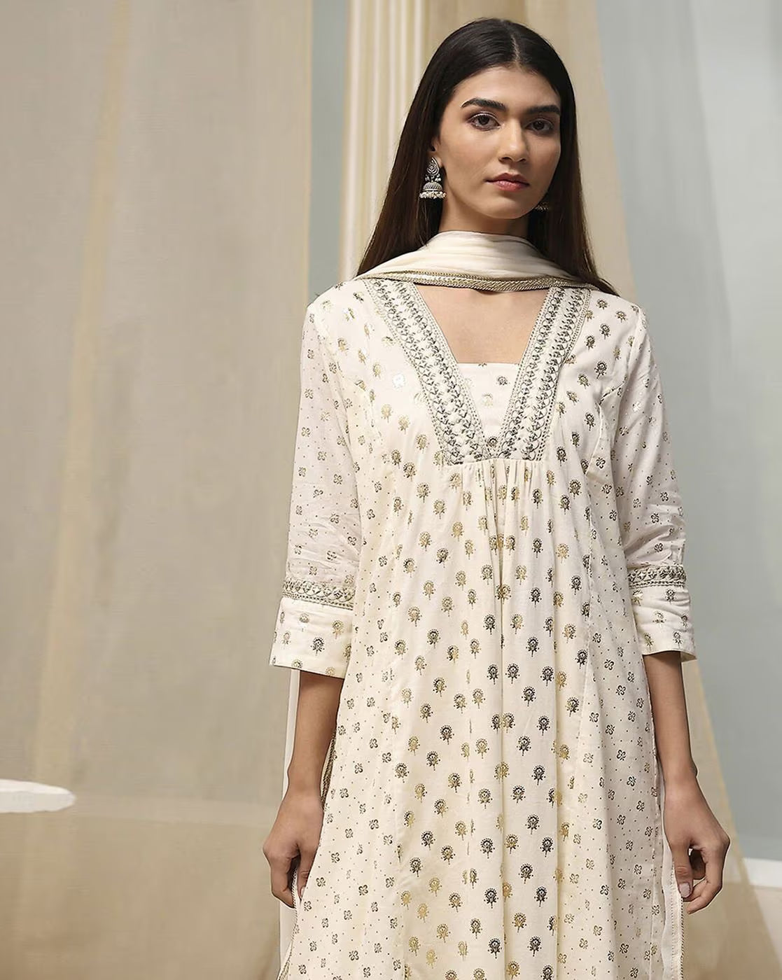 Aromie sequined embroidered kurta suit set in white with intricate detailing and a matching dupatta