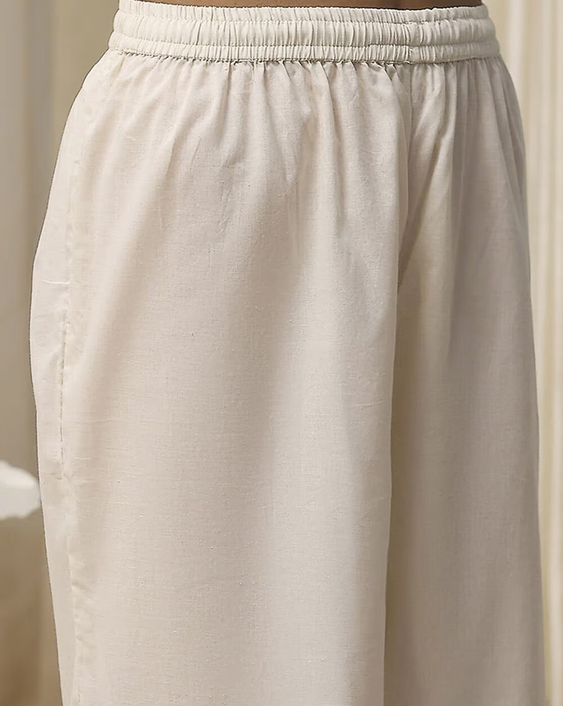 Beige pants from the sequined embroidered kurta suit set with elastic waistband for comfort and style