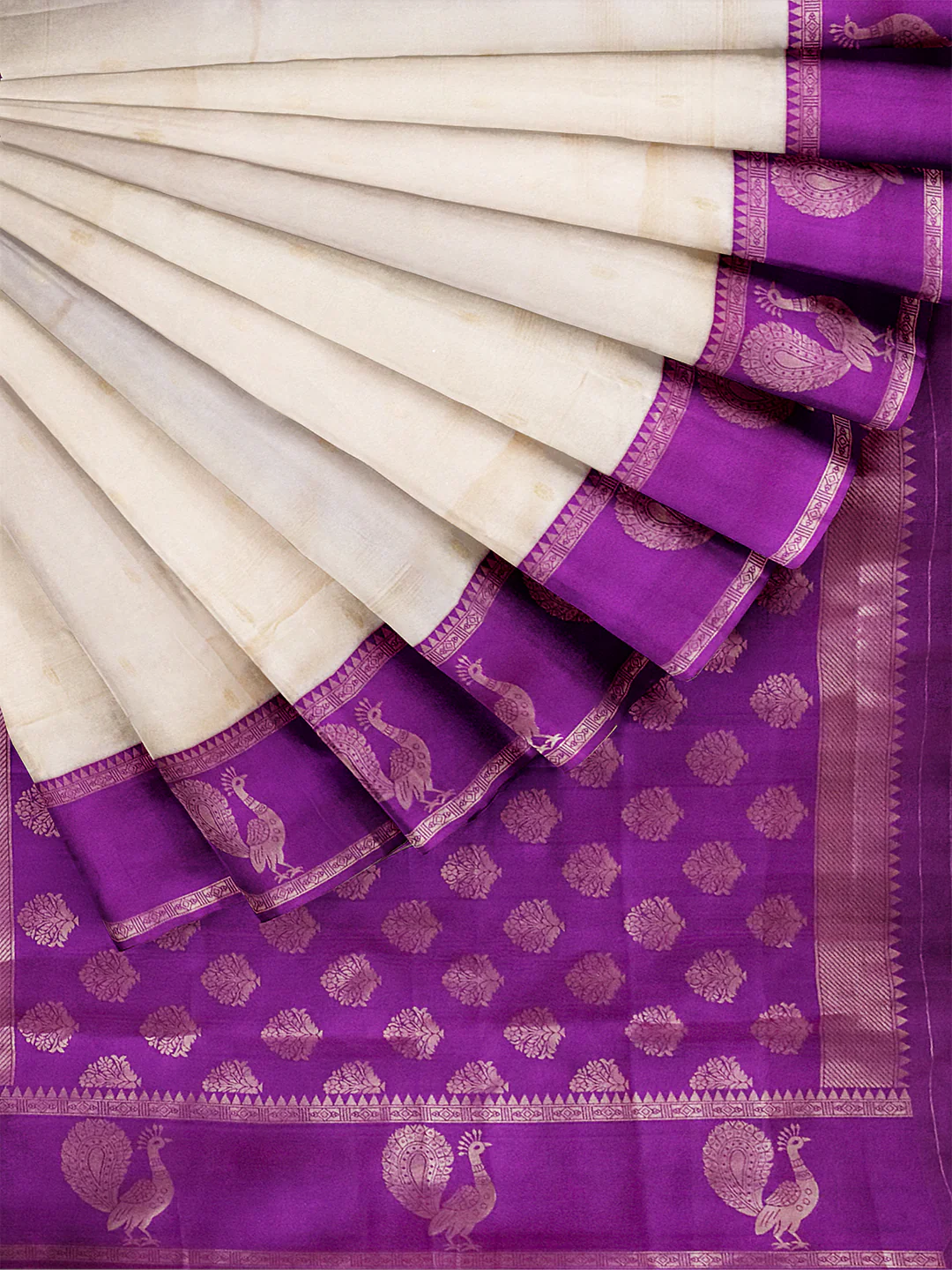 Elegant silk art saree in cream and purple with detailed peacock motifs, perfect for weddings in Canada.