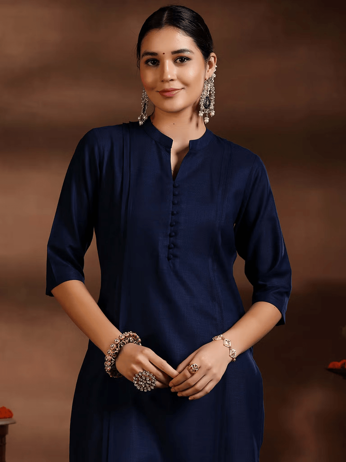 Elegant silk blend kurta set in navy blue with a stylish buttoned placket and three-quarter sleeves
