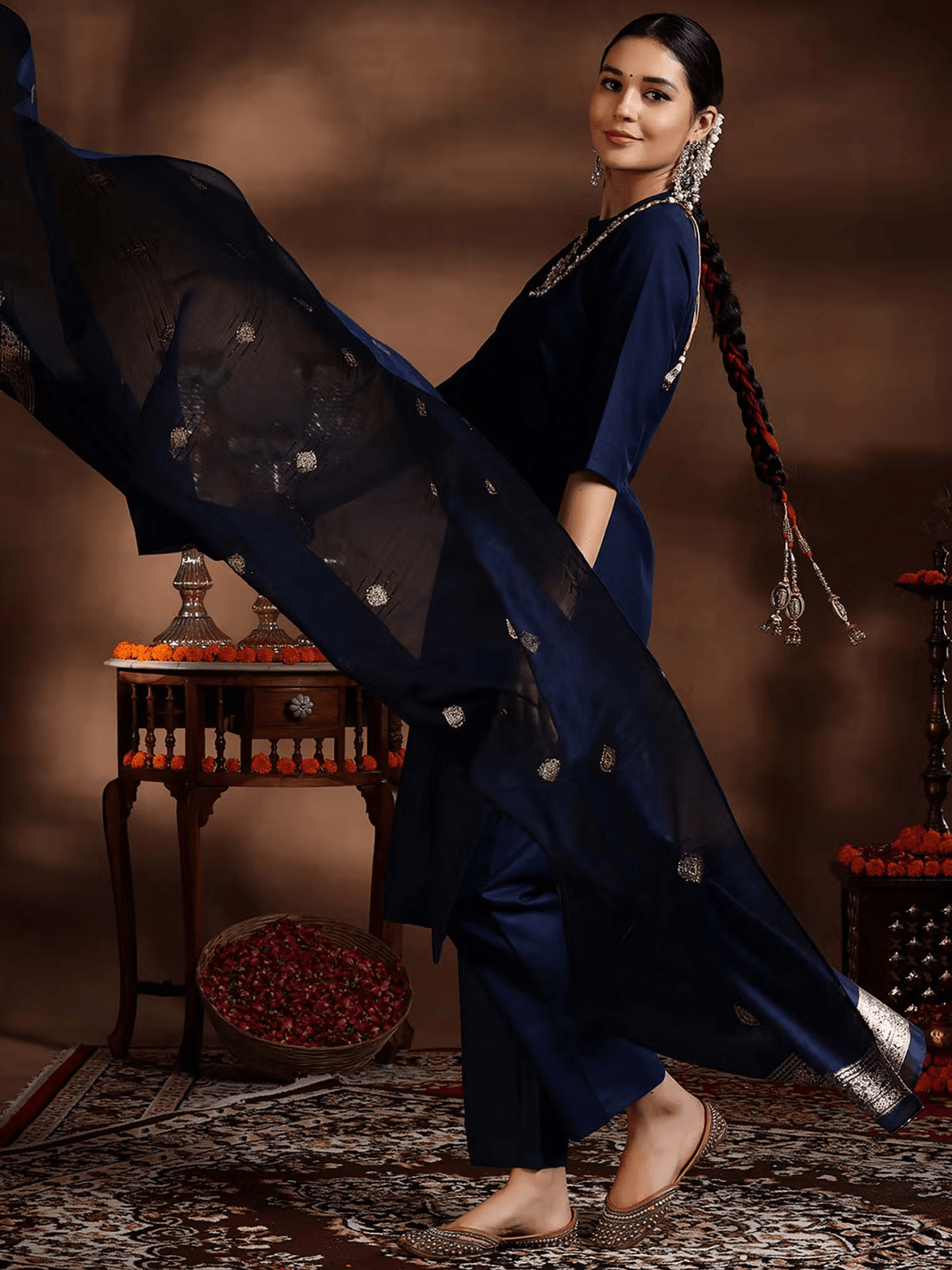 Navy silk blend kurta set featuring intricate embellishments and a flowing dupatta for elegant occasions