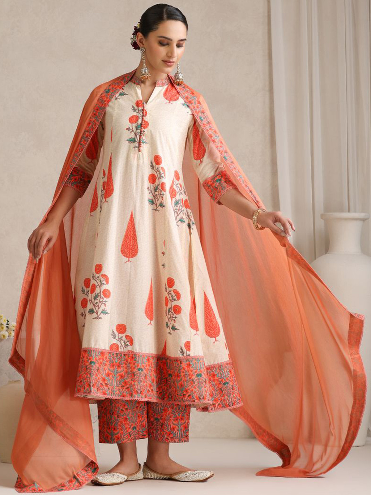 Elegant silk blend kurta set with floral prints, matching dupatta, and stylish palazzo pants