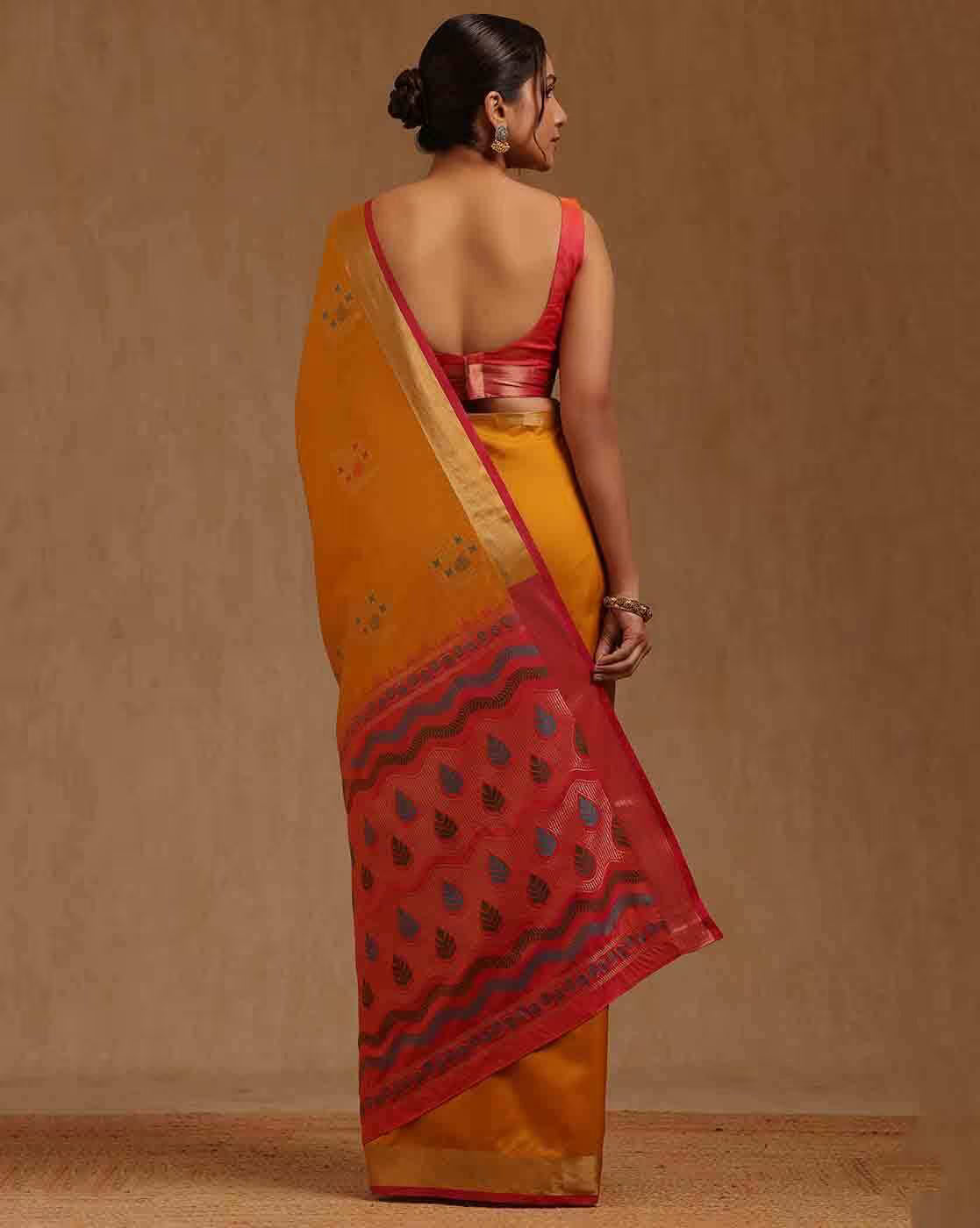 Elegant yellow silk blend saree Canda with red border, perfect for festive occasions or weddings.