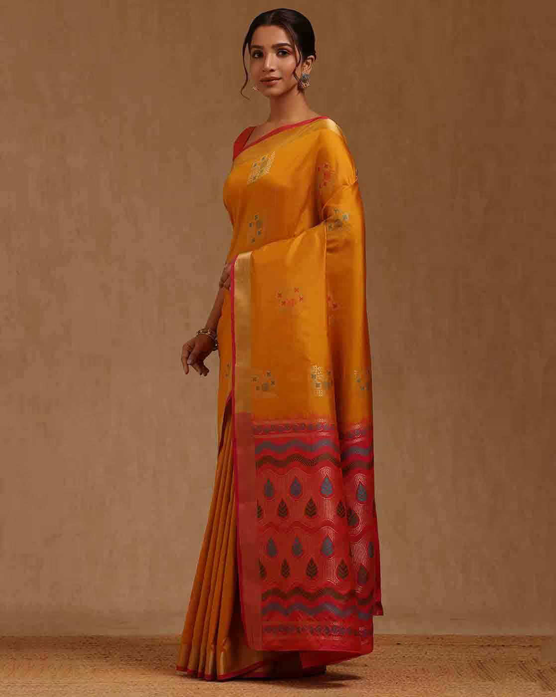 Elegant yellow silk blend saree Canda with intricate red embroidery, perfect for festive occasions