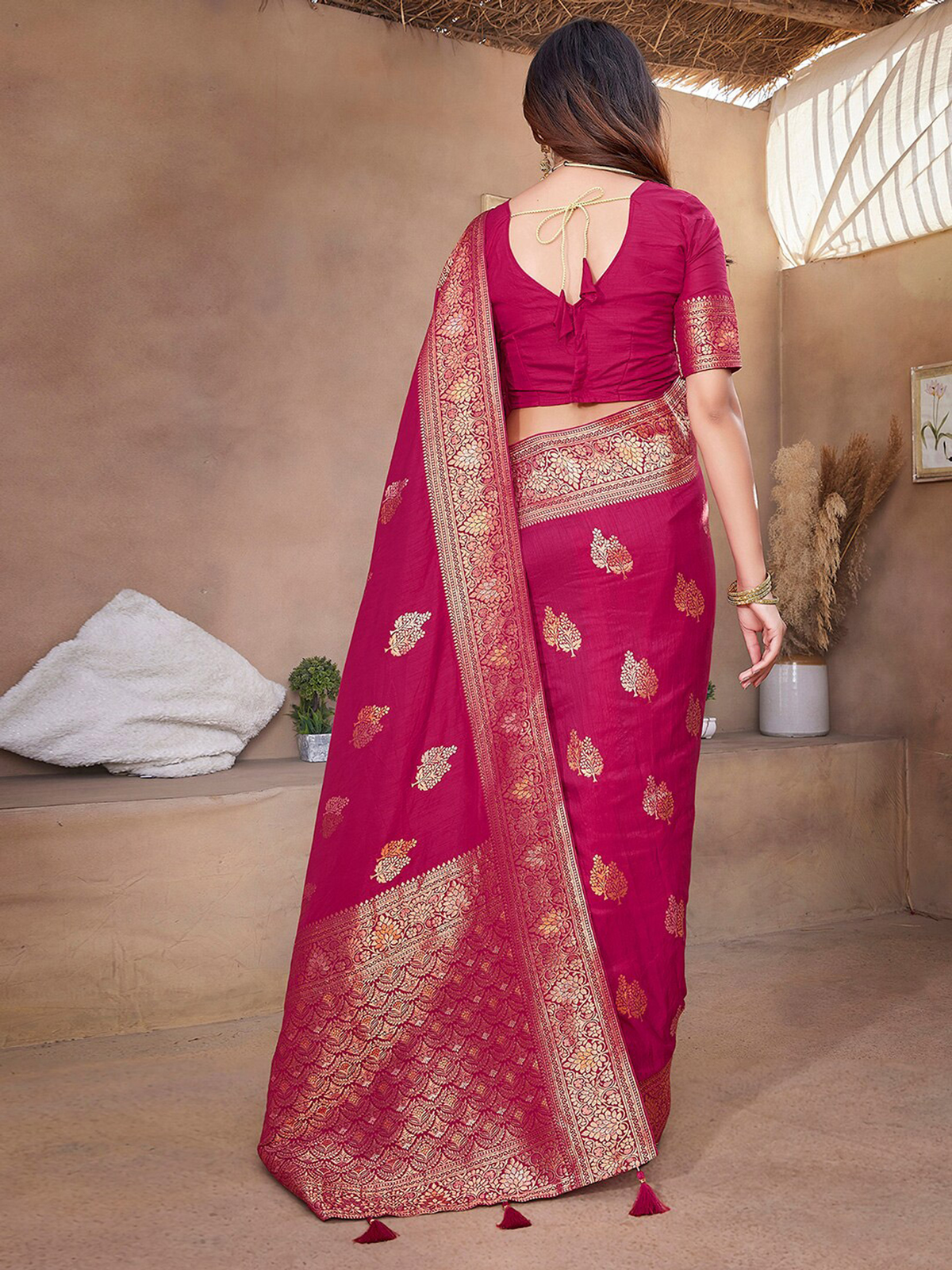Aromie silk saree in rich maroon with intricate gold embroidery, ideal for weddings and festive occasions