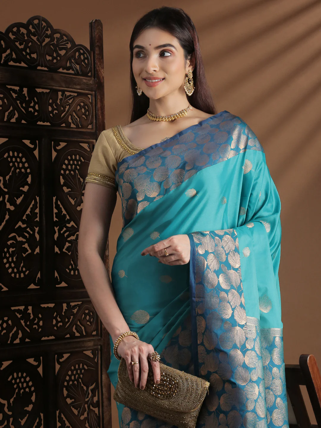 Aromie soft silk saree in turquoise with gold motifs, perfect for weddings and festive occasions