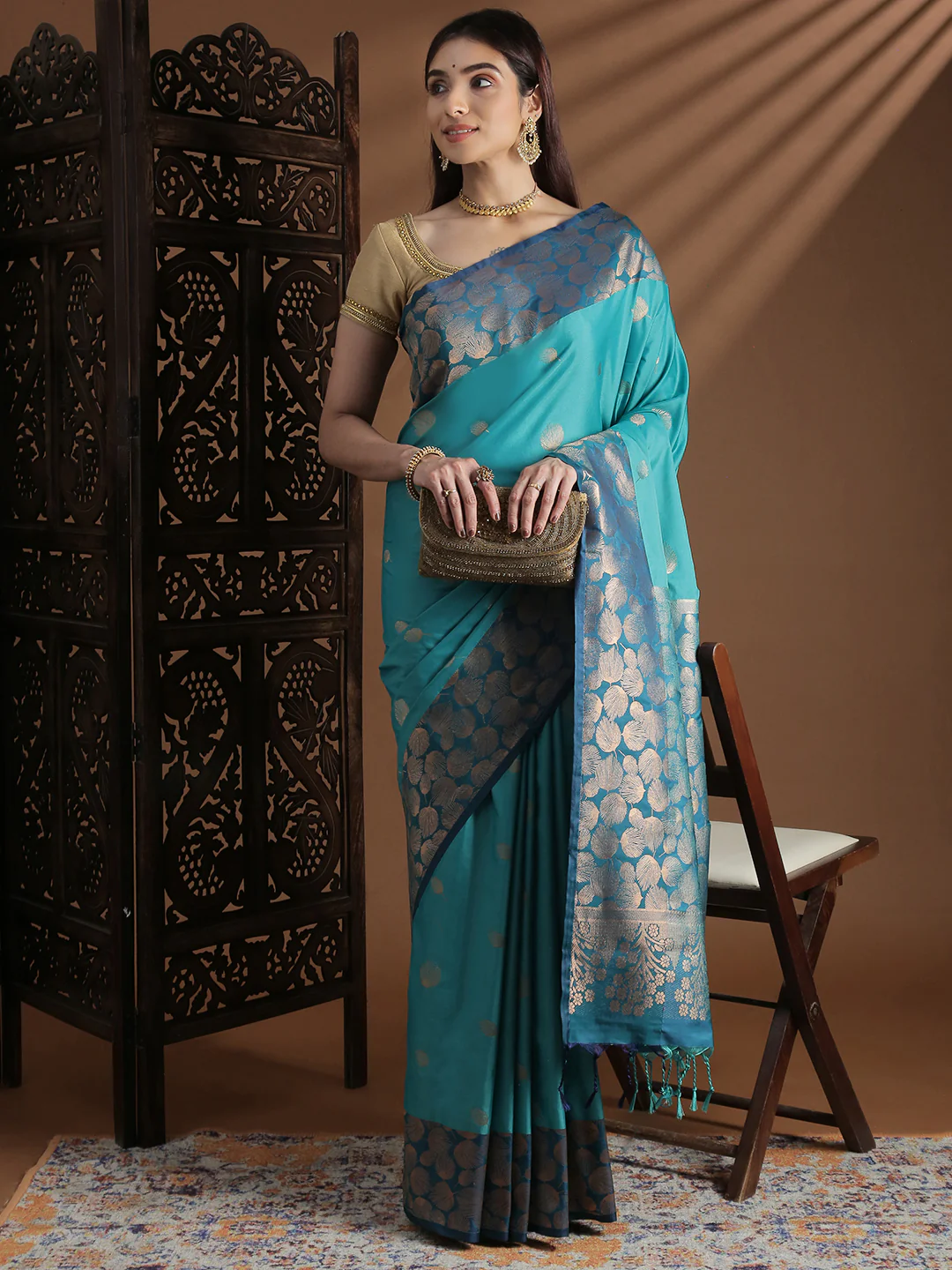 Front view of a turquoise soft silk saree Canada with floral patterns, perfect for weddings and special occasions