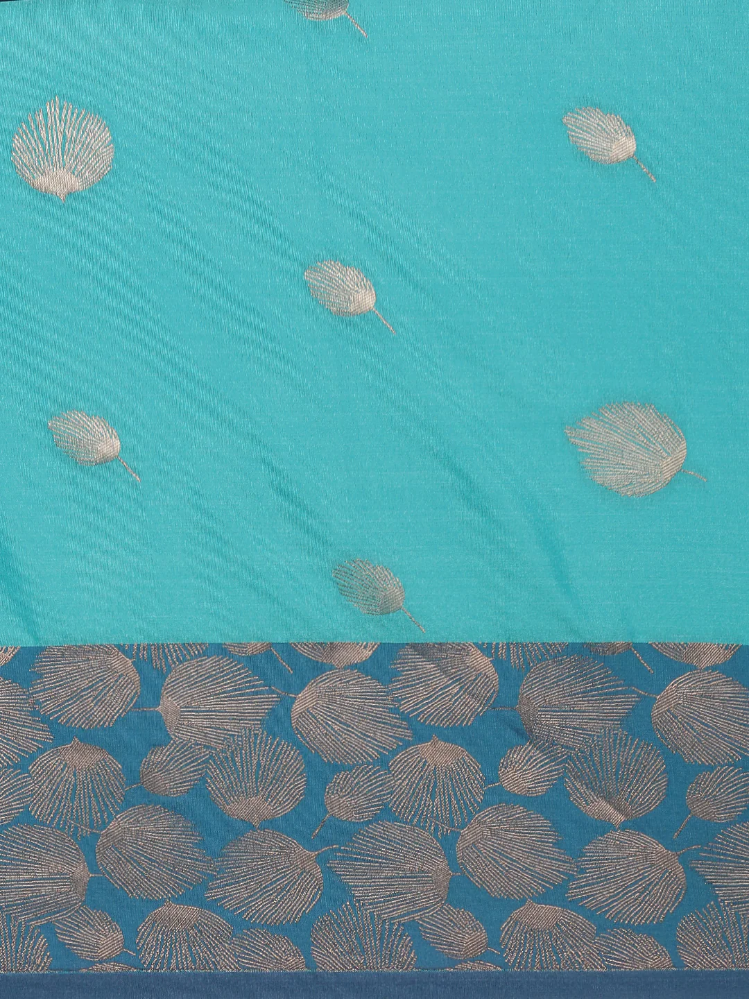 Soft silk saree in turquoise with intricate leaf motifs, perfect for elegant occasions in Canada.