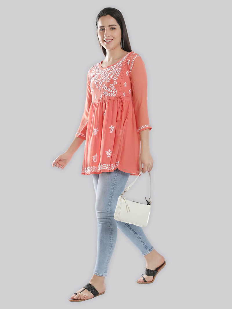 aromie coral embroidered single piece kurta worn with jeans and white bag styled as fusion jumpsuit for women