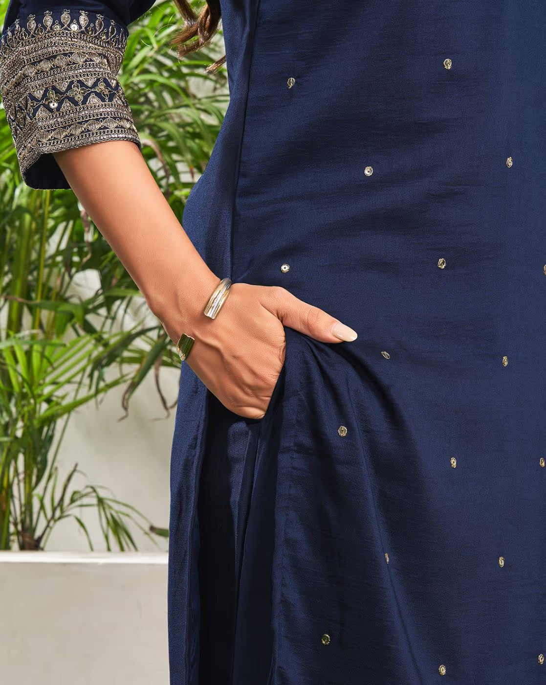 Elegant navy blue sequined embroidered kurta suit set featuring intricate detailing and pockets
