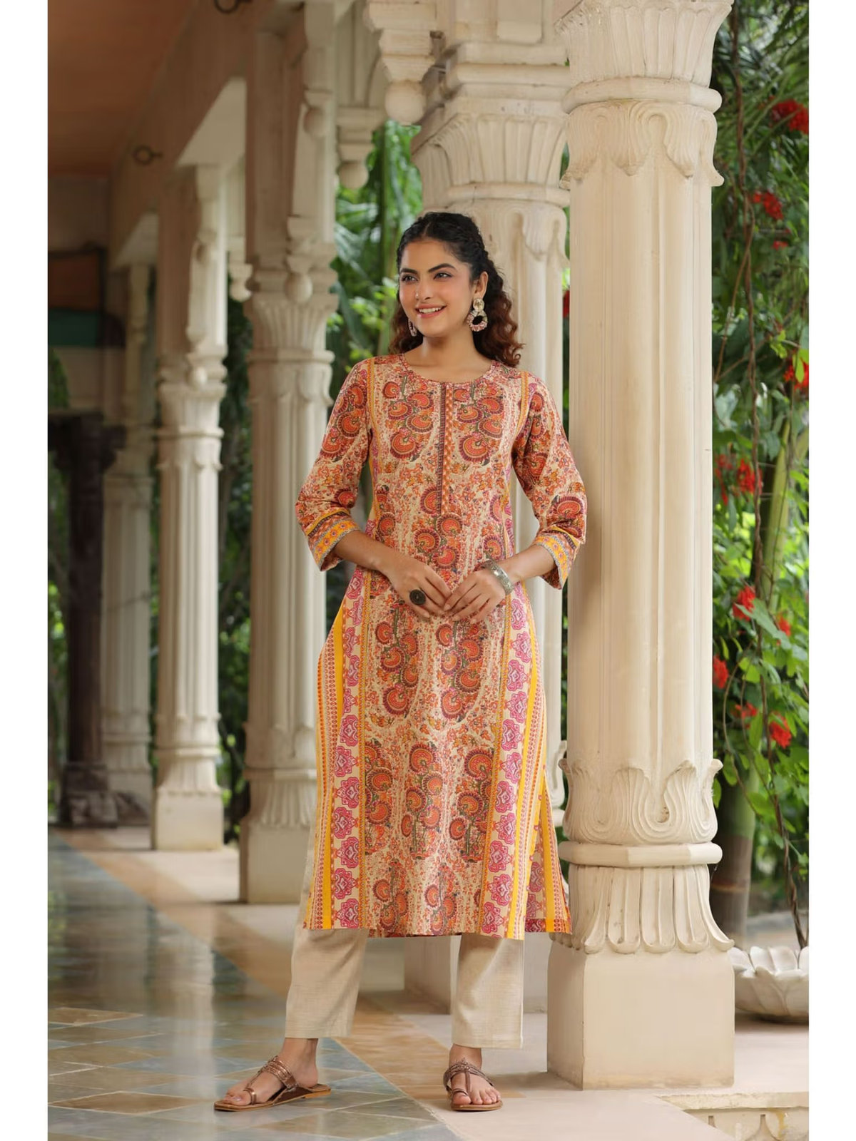 Aromie fusion wear flared jumpsuit for women with orange paisley print and contrast yellow side panels