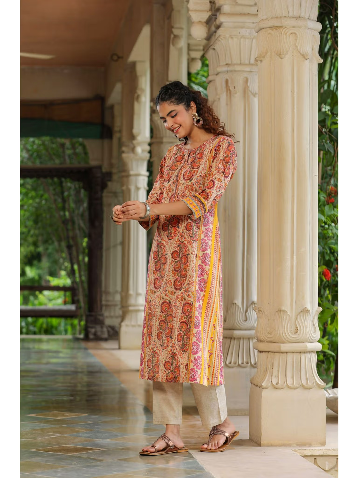 aromie Fusion Wear flared jumpsuit for women styled like a printed long kurta with beige pants