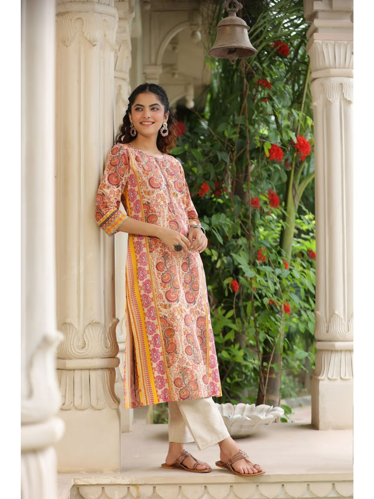 Aromie fusion wear printed kurta resembling a flared jumpsuit for women paired with beige trousers and sandals
