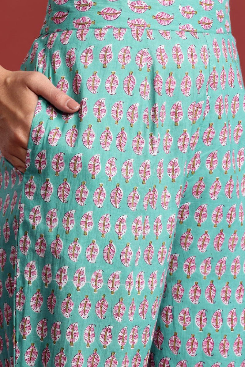 Teal floral kurta set featuring intricate leaf patterns for a stylish ethnic look