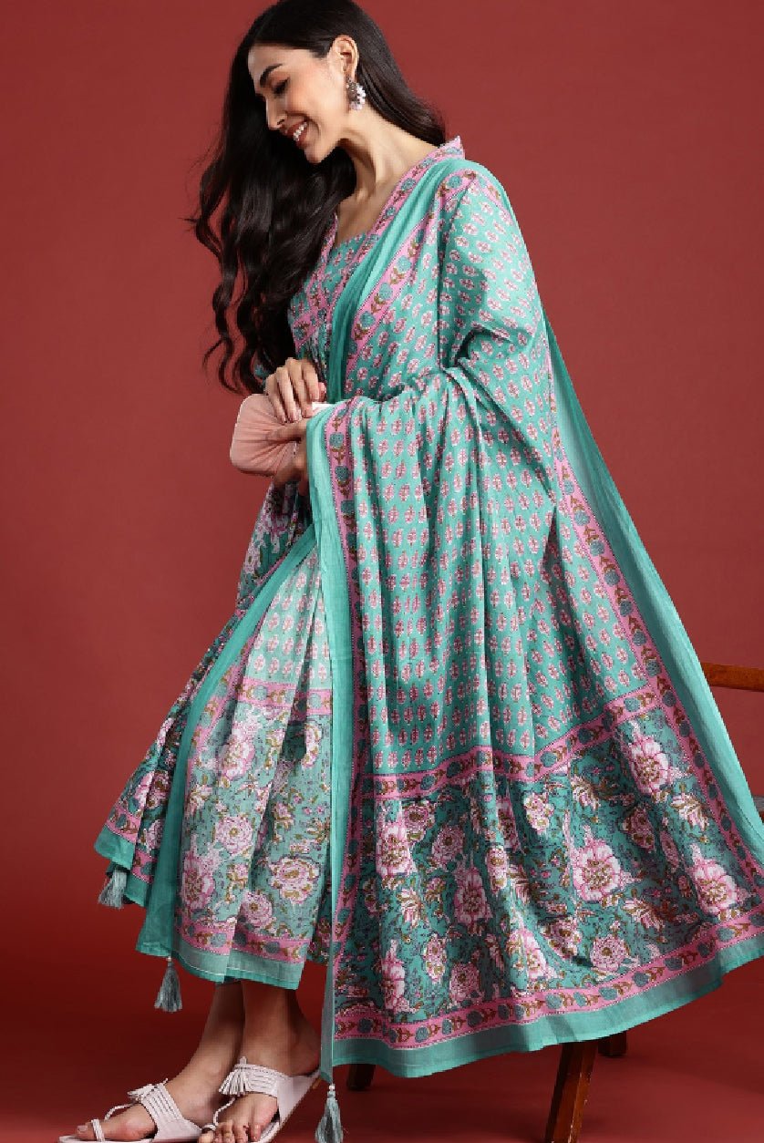 Teal floral kurta set by Aromie featuring intricate patterns and a flowing silhouette