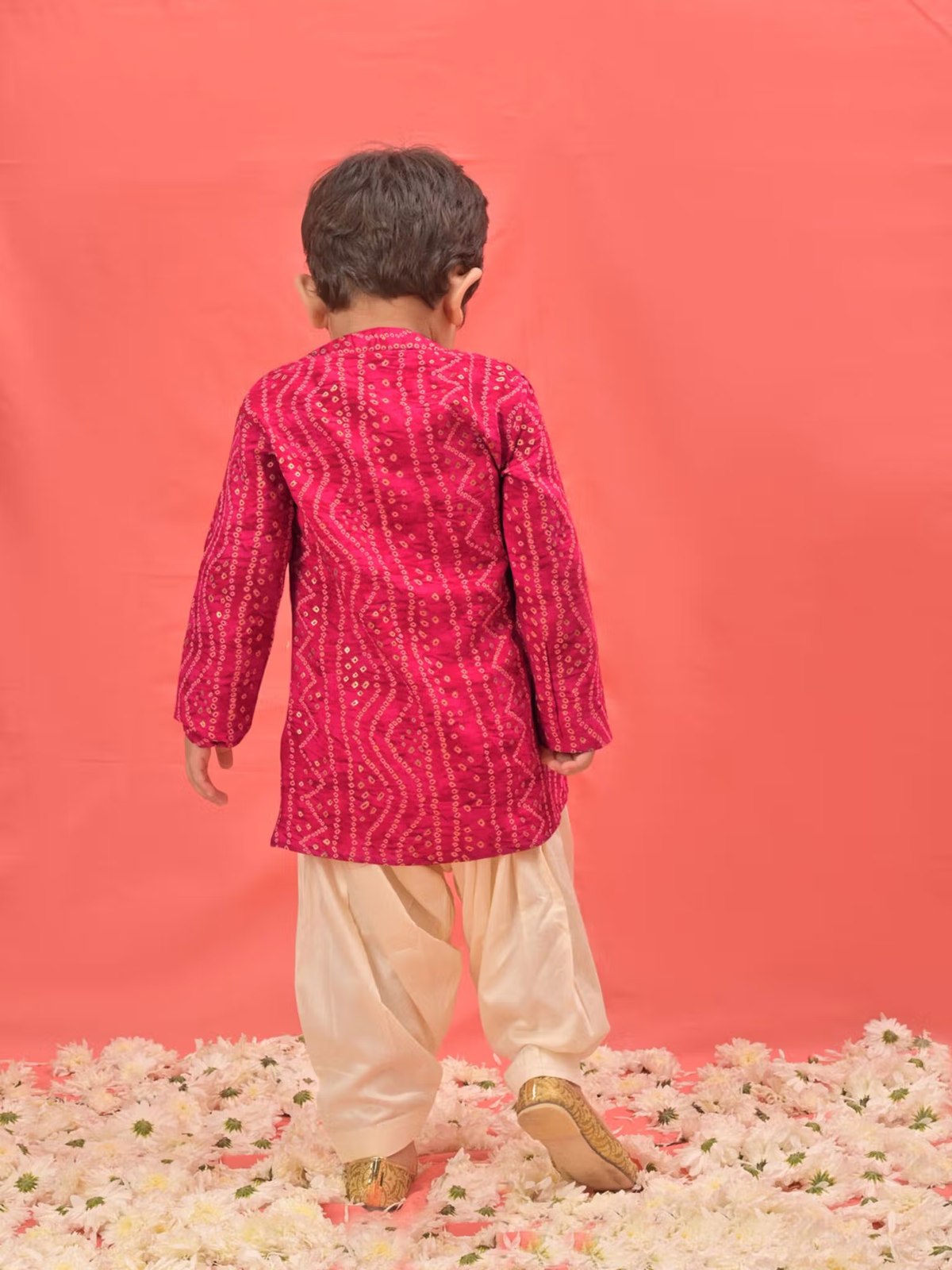 infant boys pink kurta patiala set featuring embroidered magenta kurta and ivory patiala pants on floral backdrop