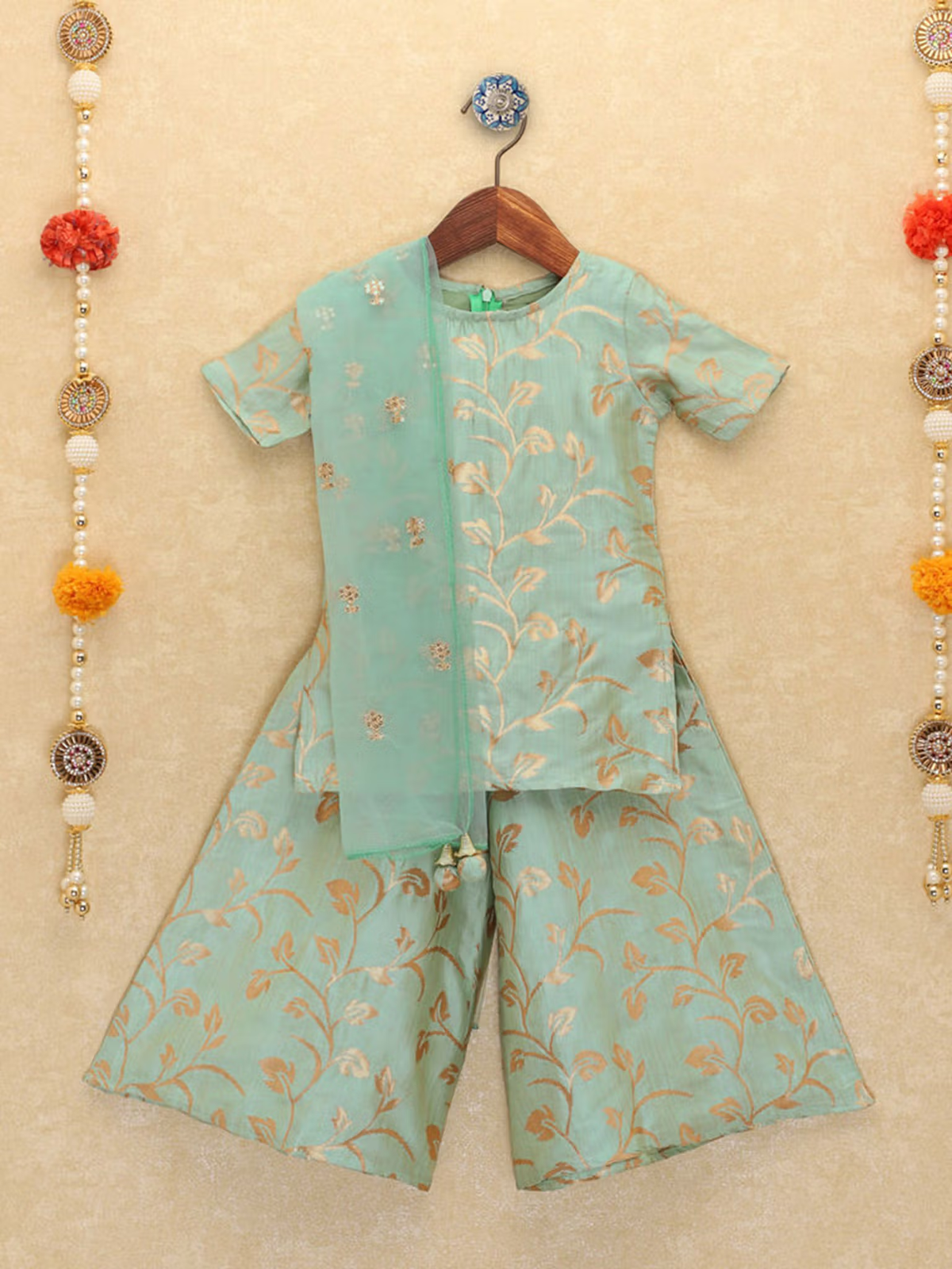 Mint green leaf printed kurta palazzo dupatta set with gold vine motifs and short sleeves