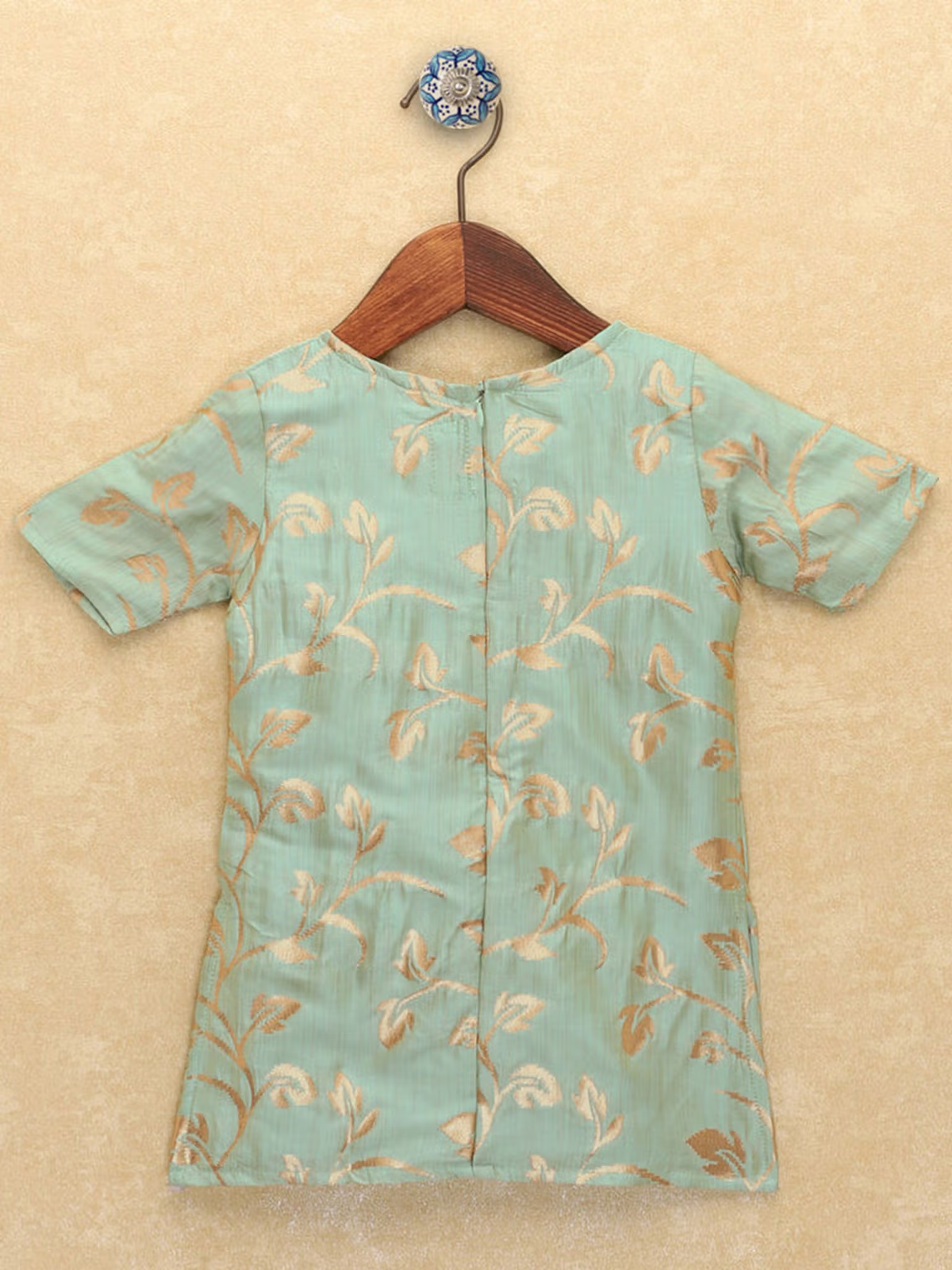 Mint green kurta back view with gold leaf print on wooden hanger green leaf printed kurta palazzo dupatta set for festive wear