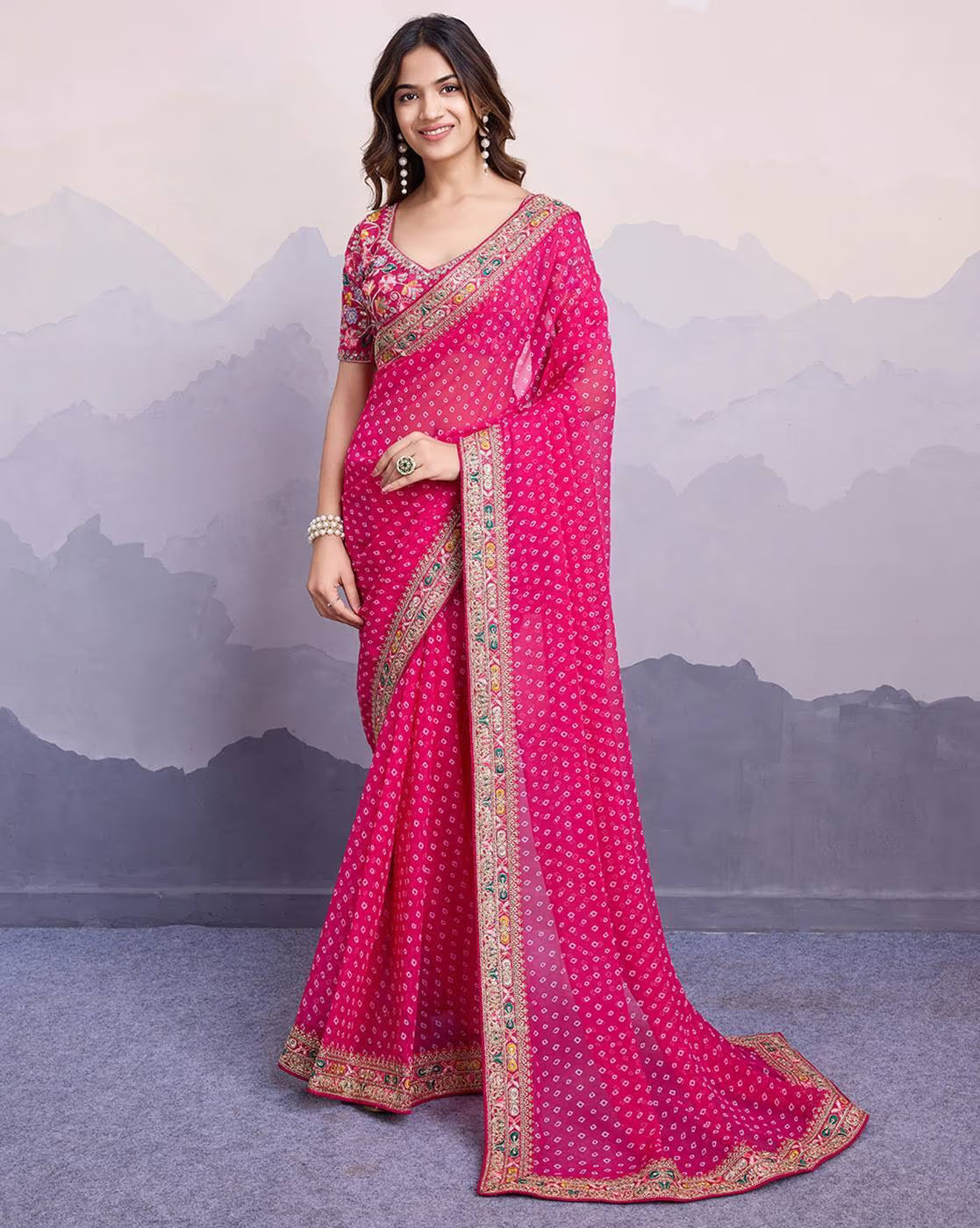 Aromie tissue saree for parties in vibrant pink with intricate detailing and a stylish border