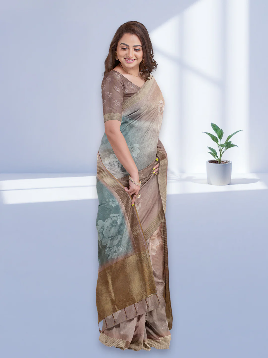Elegant tissue saree in beige and blue with floral design, perfect for weddings and special occasions in the USA.