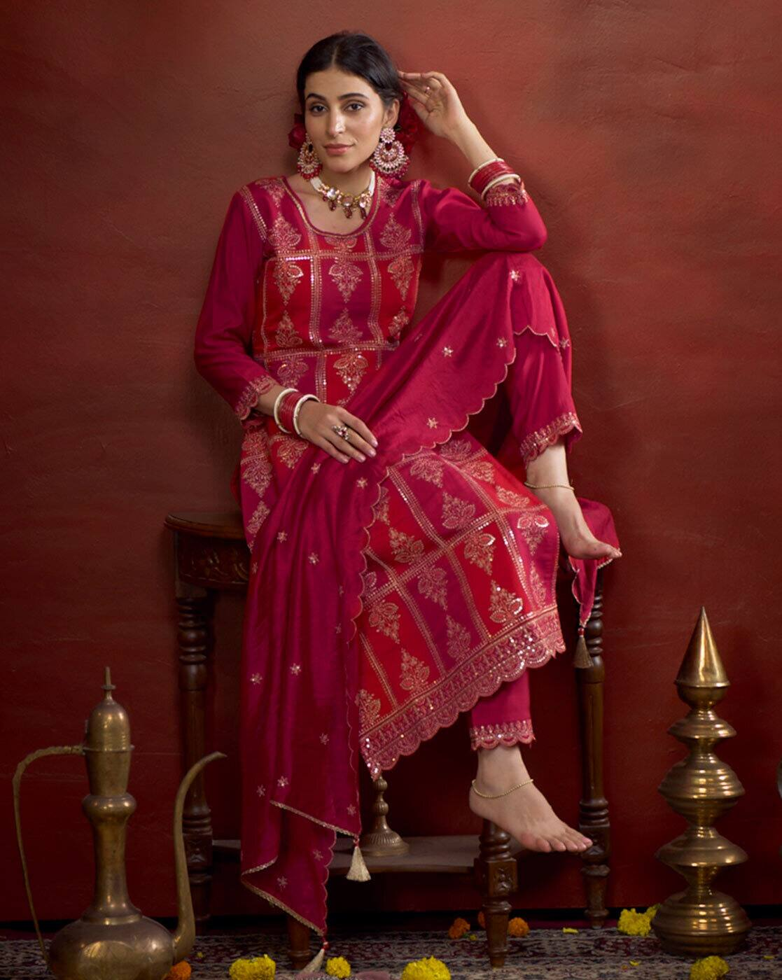 Aromie three piece elegant bandhani kurta set in deep pink with intricate gold patterns and matching dupatta