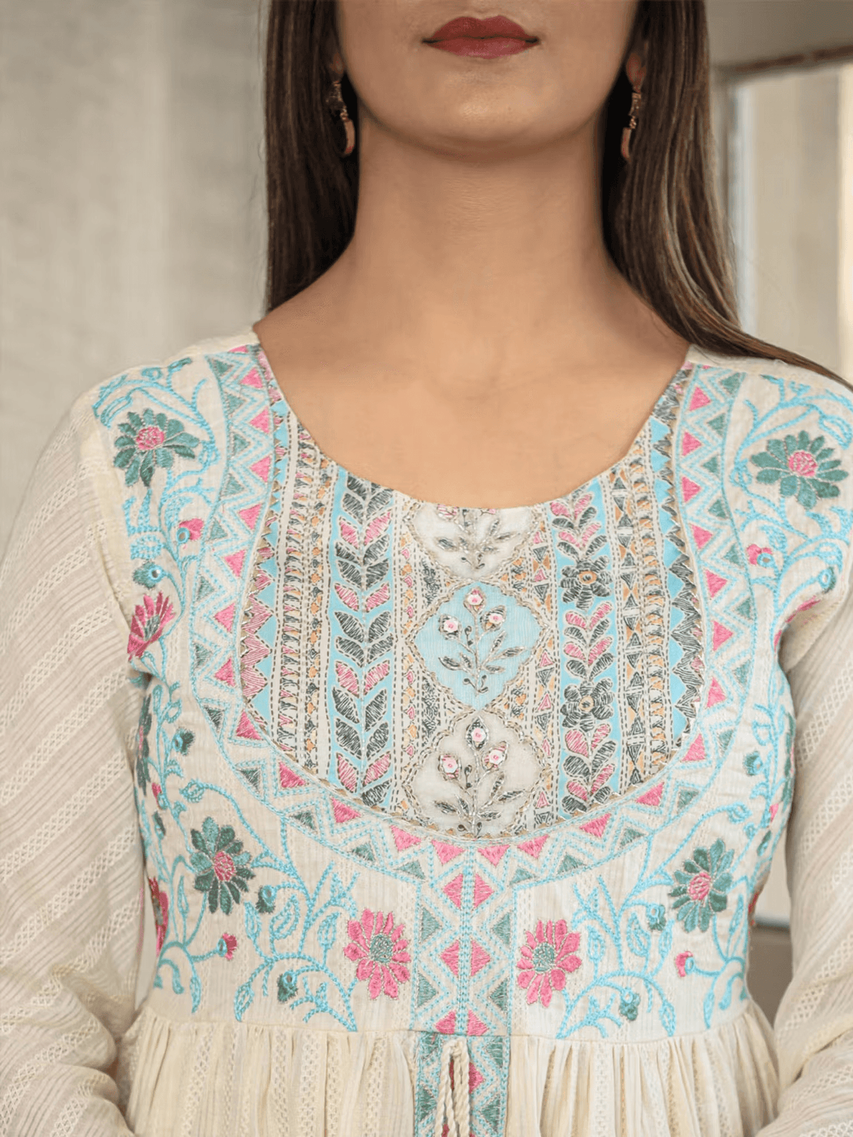 Floral Anarkali kurta pants set with intricate embroidery and a stylish neckline by Aromie