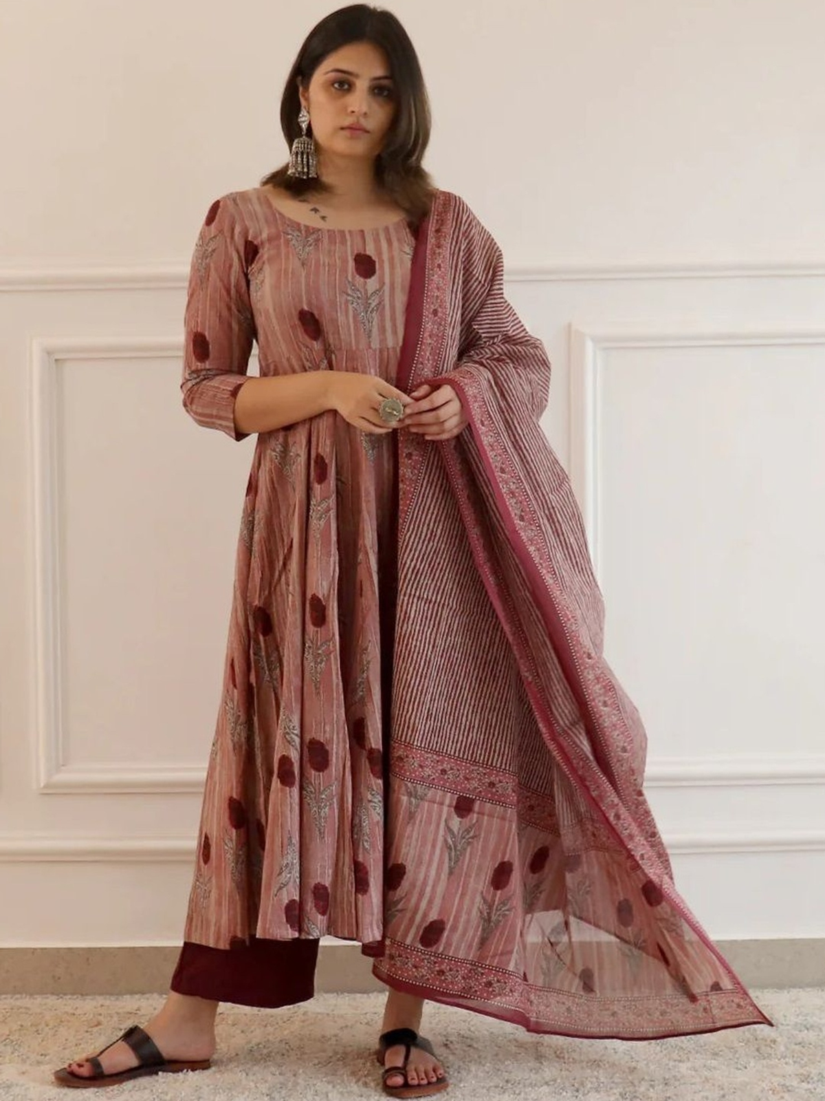Pink floral anarkali kurta palazzo set by Aromie featuring intricate designs and elegant styling