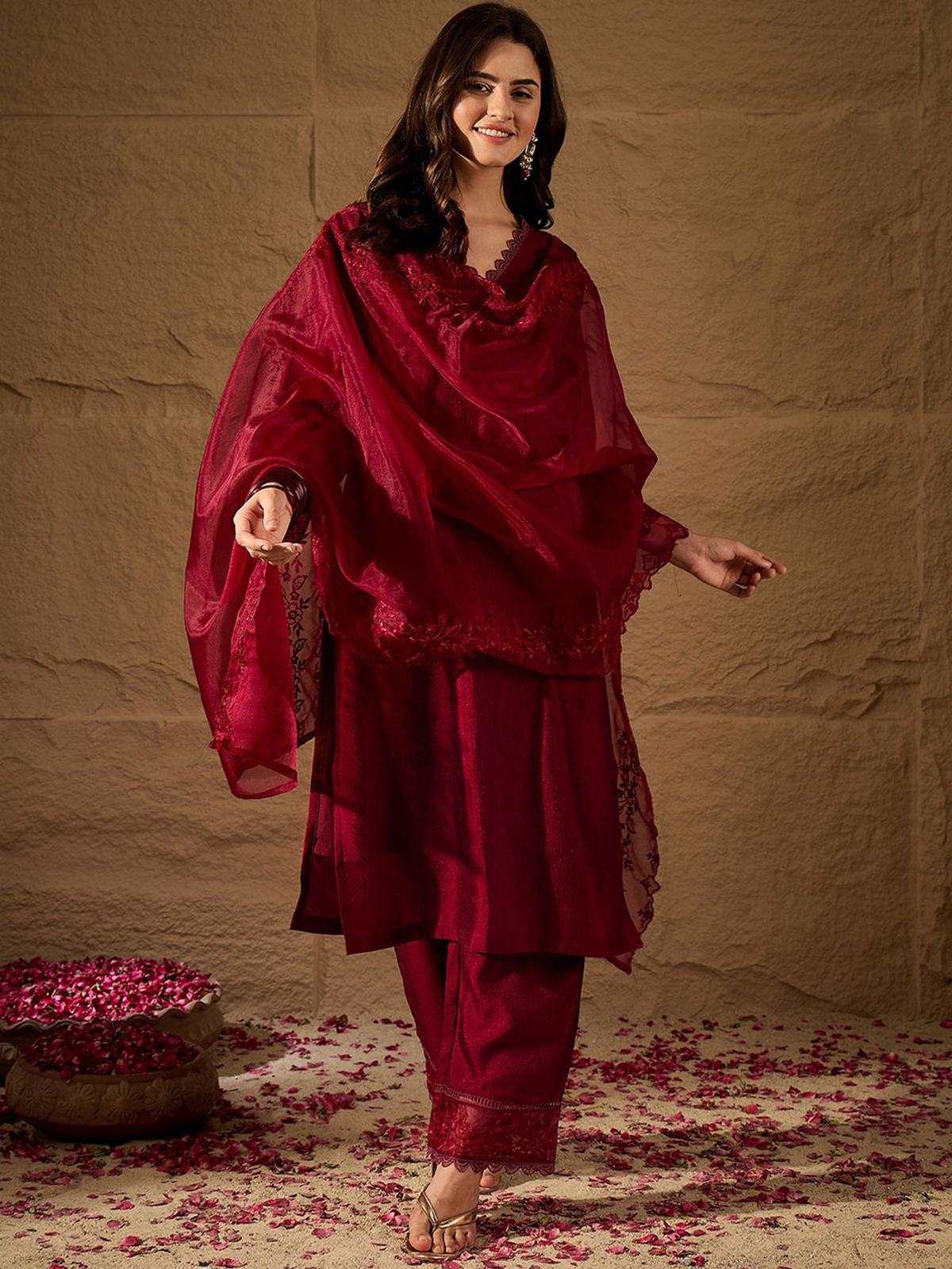 Elegant three piece rayon kurta set with kalamkari dupatta in deep red, perfect for festive occasions.
