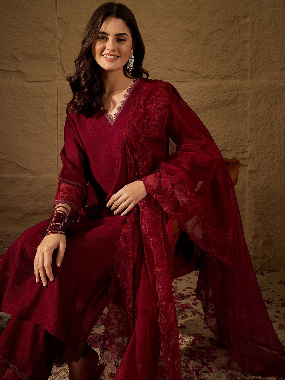 Elegant three piece rayon kurta set with kalamkari dupatta in maroon, featuring intricate details.