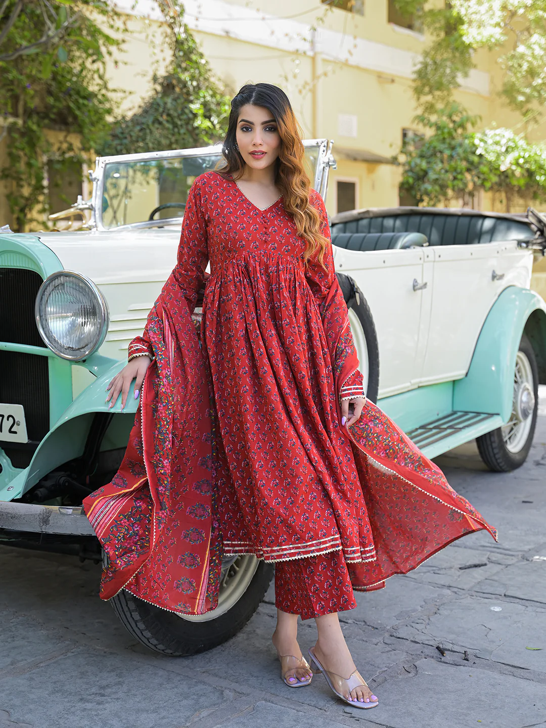 Red Anarkali kurta trouser set with dupatta featuring a beautiful floral design and elegant styling