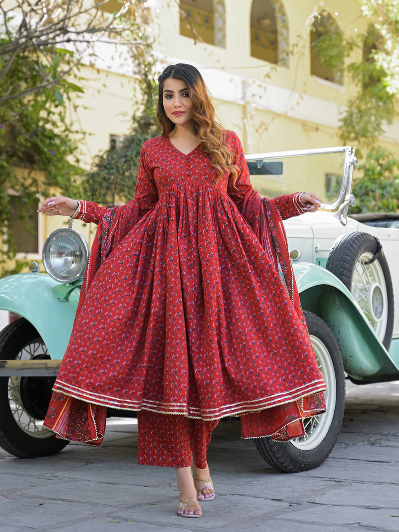 Red Anarkali kurta trouser set with dupatta featuring a flowy design and traditional print