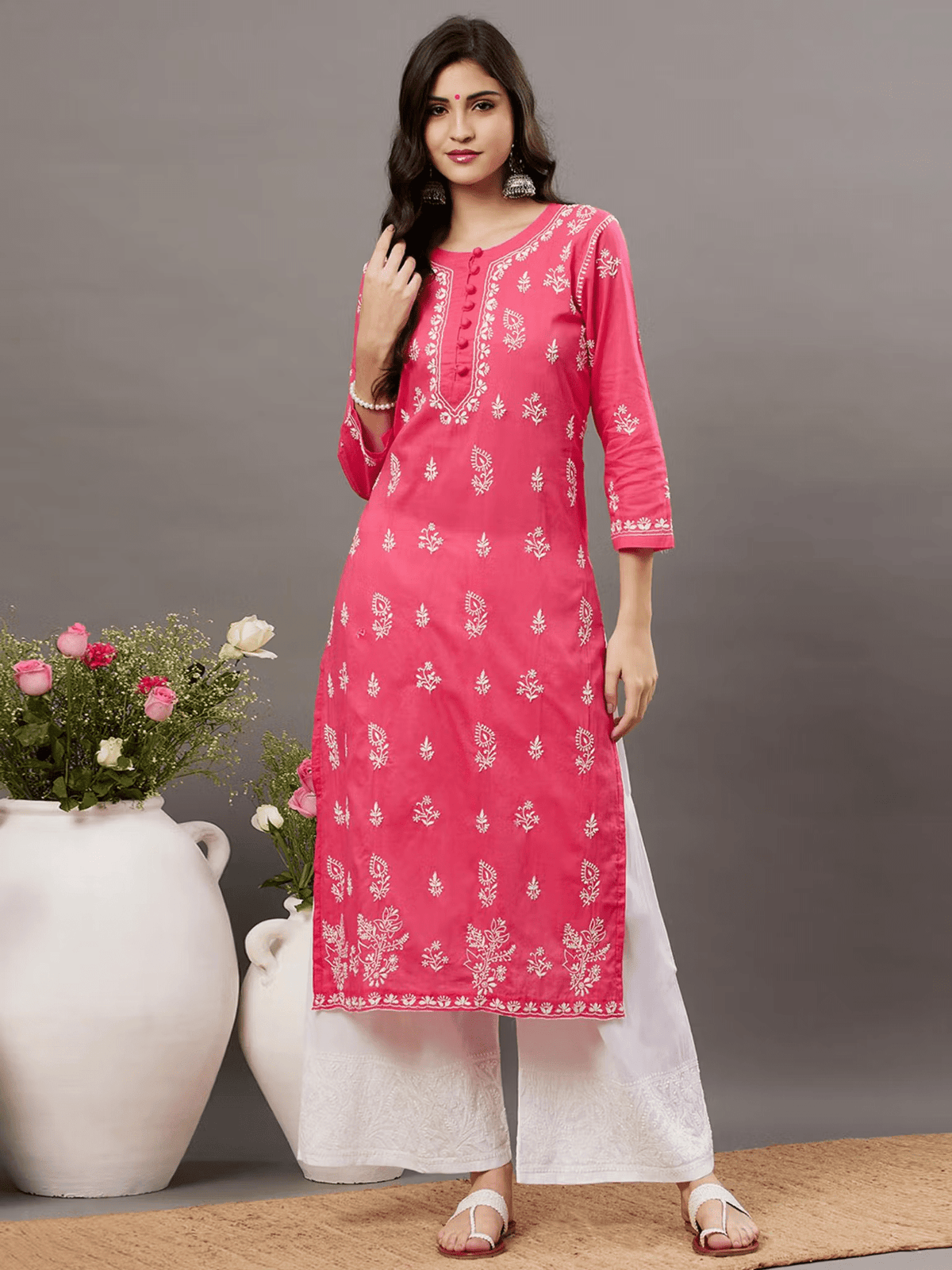 Aromie three piece kurtha set featuring a pink kurta with floral embroidery paired with White Cotton Chikankari Palazzo