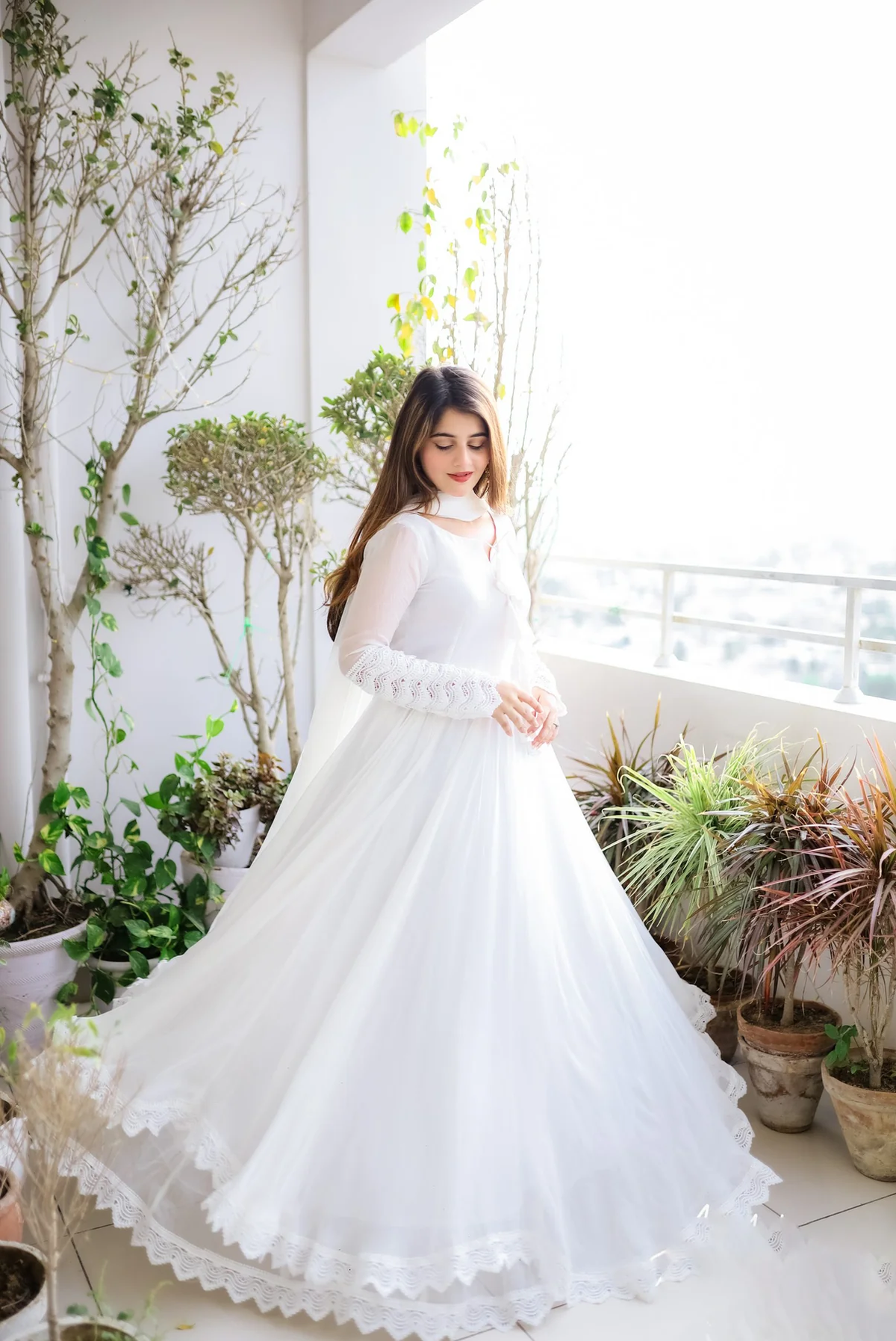 Aromie white double layered anarkali with dupatta, featuring intricate lace details, ideal for weddings and festive occasions.