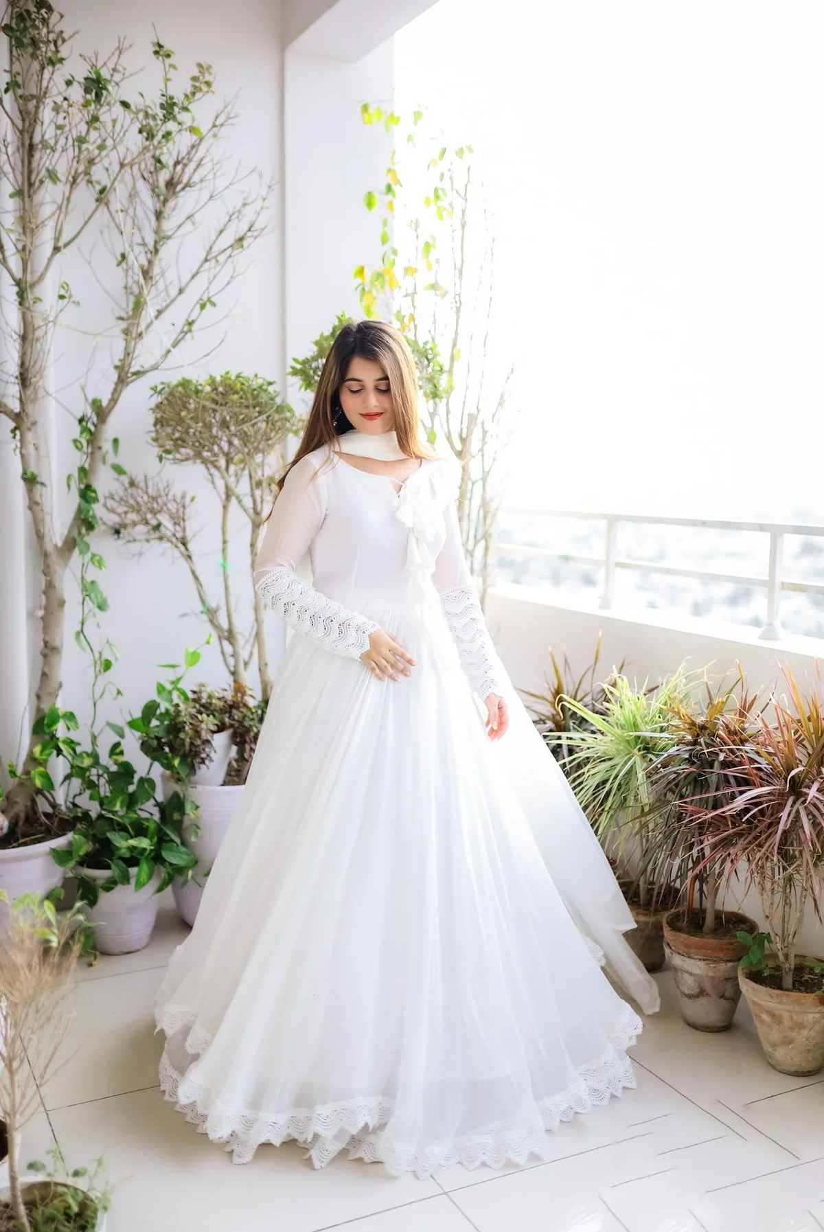 Elegant white double layered anarkali with dupatta, perfect for weddings or festive occasions, made from soft fabric