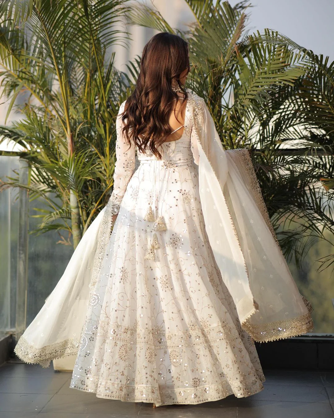 Elegant three piece Kurtha featuring a white georgette anarkali gown with intricate detailing and flowy silhouette