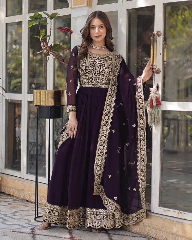 Elegant wine embroidered gown with dupatta, featuring intricate gold detailing, perfect for weddings and festive occasions
